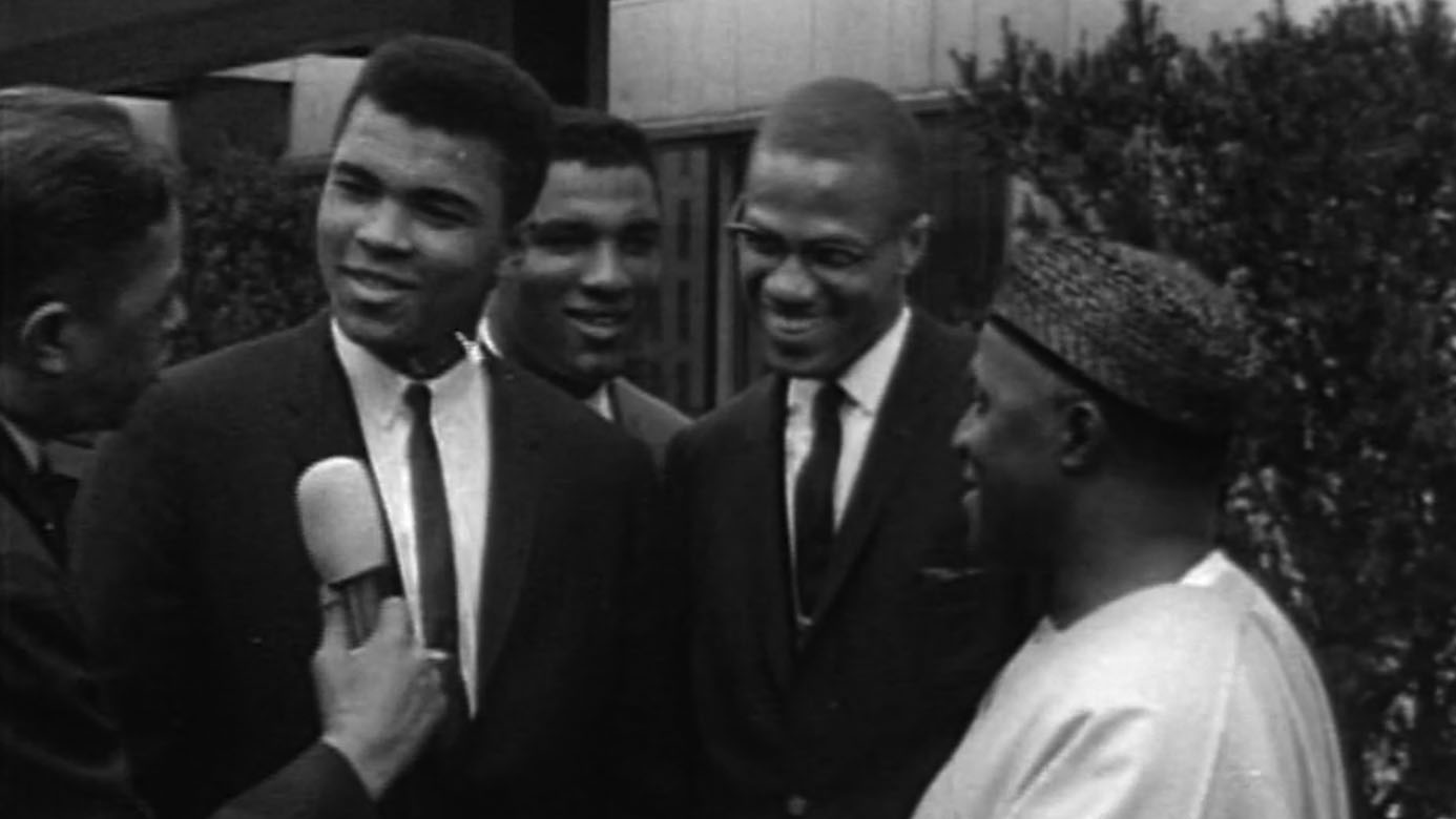 Muhammad Ali (left) and Malcolm X (second from right) in "Blood Brothers: Malcolm X & Muhammad Ali."