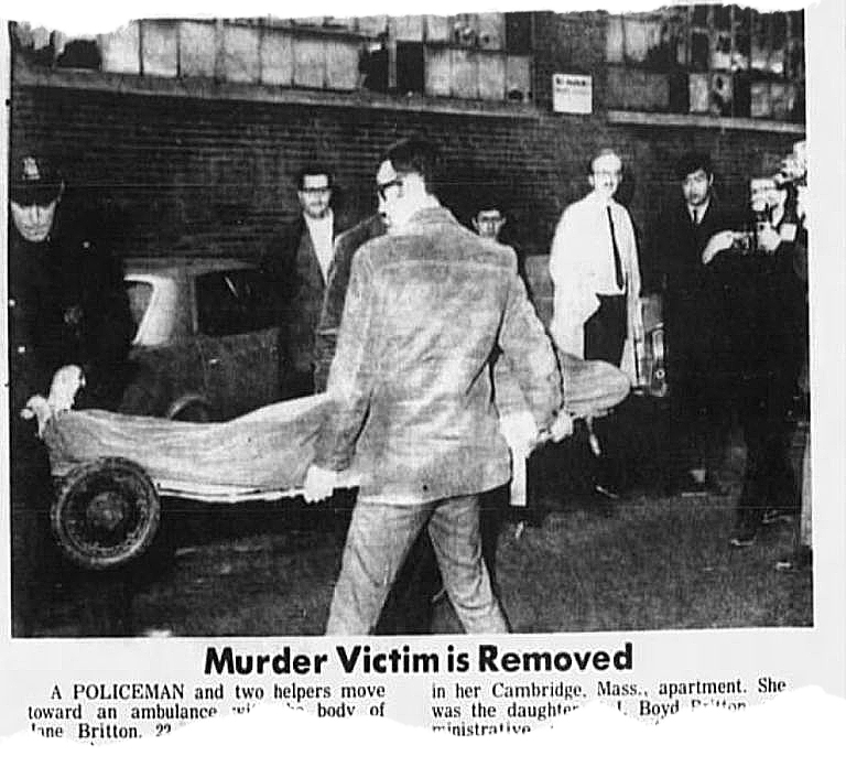 A newspaper photograph of Britton’s body being moved from her building. Then-journalist Mike Widmer (in tie and light-colored trench coat) never forgot the tragedy.