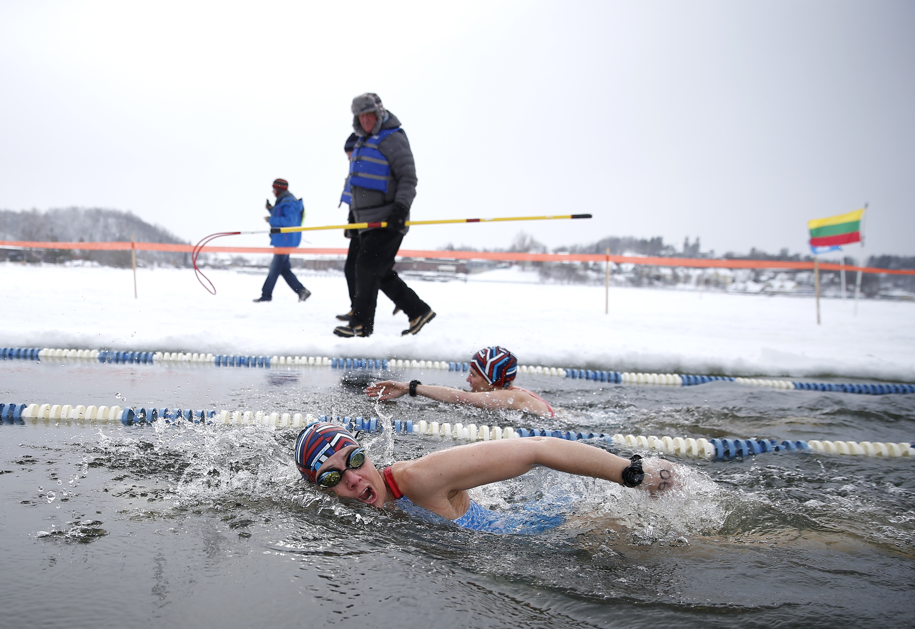 Bridget Williams of North Canton, Ohio, competed while a “hooker” walked alongside in case a swimmer needed to be pulled from the water.