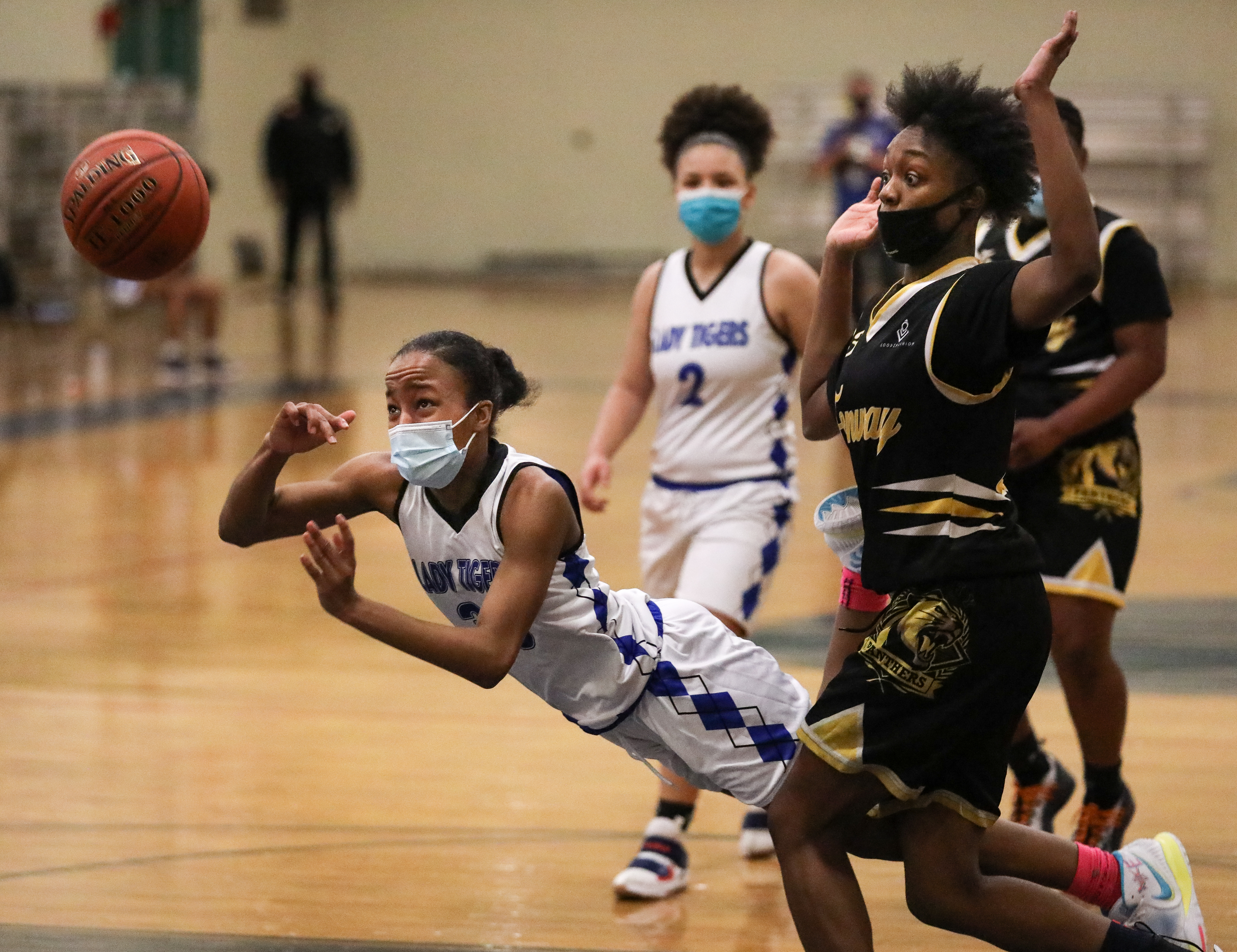 O’Bryant’s Jahbria Horsley (30) makes a diving pass after colliding with Fenway’s Kayana Armbrister (24).