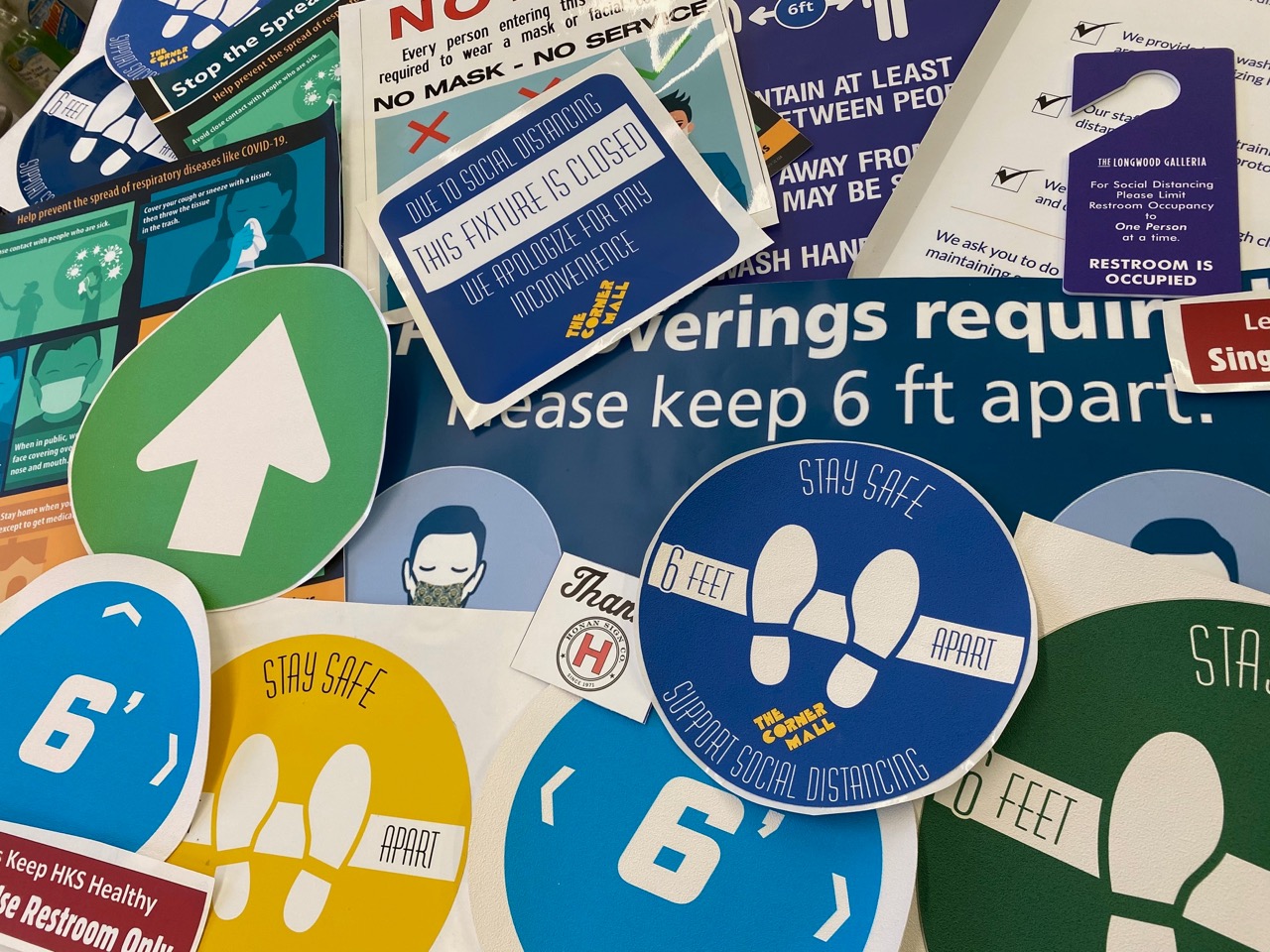 A collage of signs and stickers.