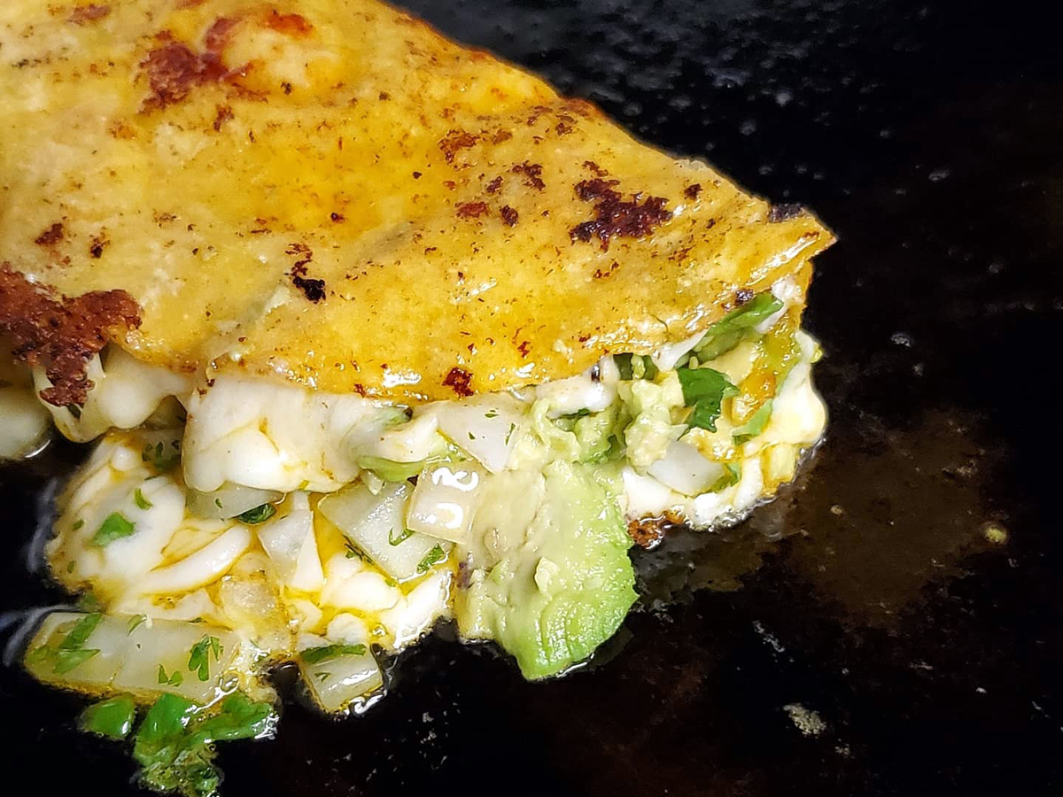 An off-the-menu avocado, cheese, and onion tacodilla from La Tacodilla in Dennis.
