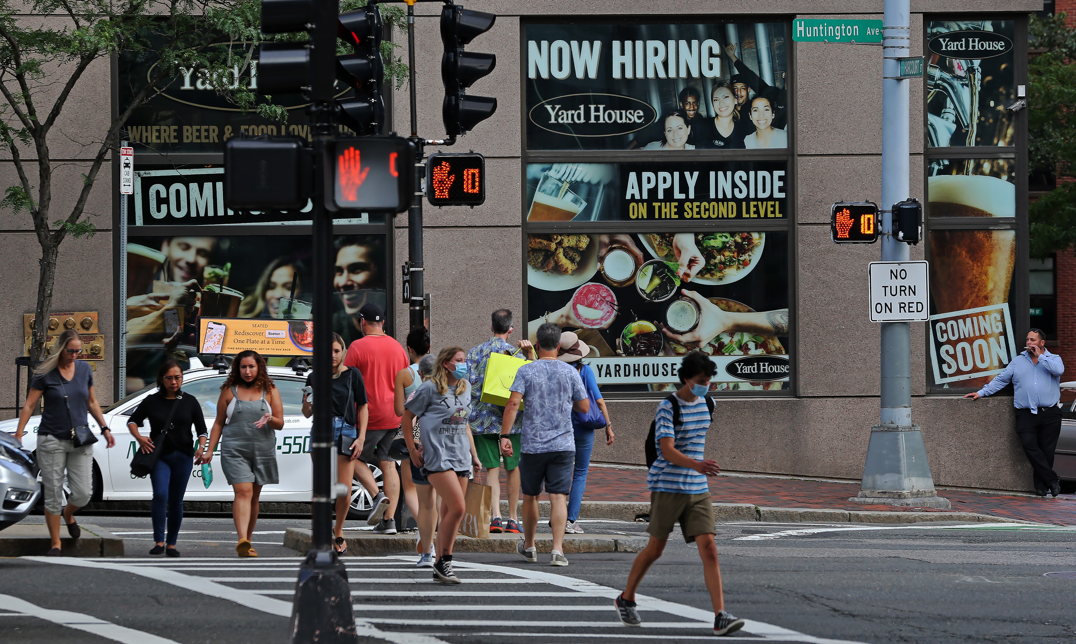 A large sign seeking workers the Yard House restaurant inside the Copley Marrriot on Huntington Avenue.