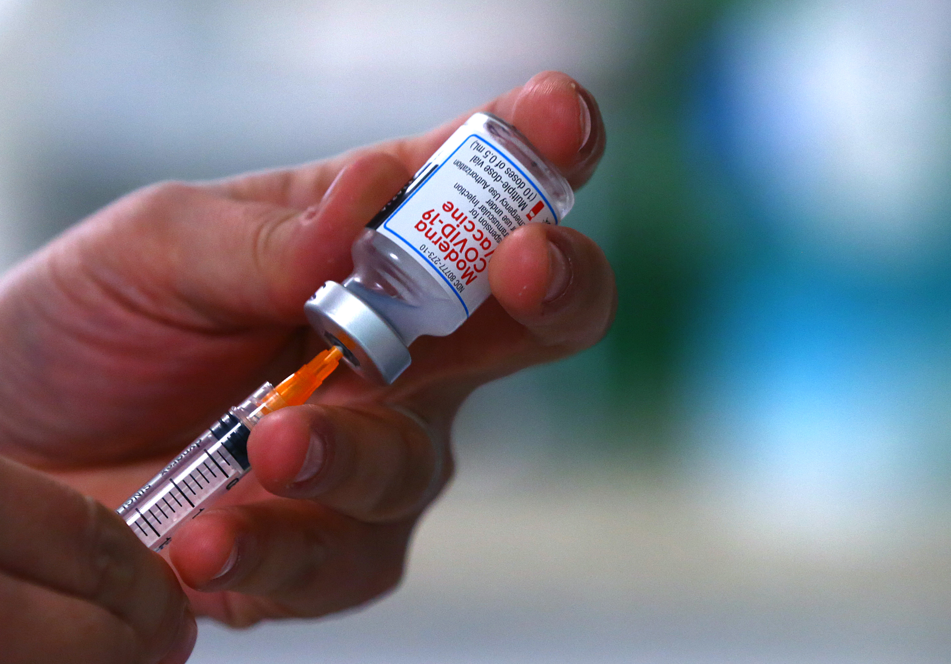 Dr. Beata Nelken draws a dose of the Moderna COVID-19 vaccine. However, on further questioning of the woman who was to receive it, it was determined that she came one day too soon for her second shot. The drawn dose was returned to the refrigerated unit for later use.
