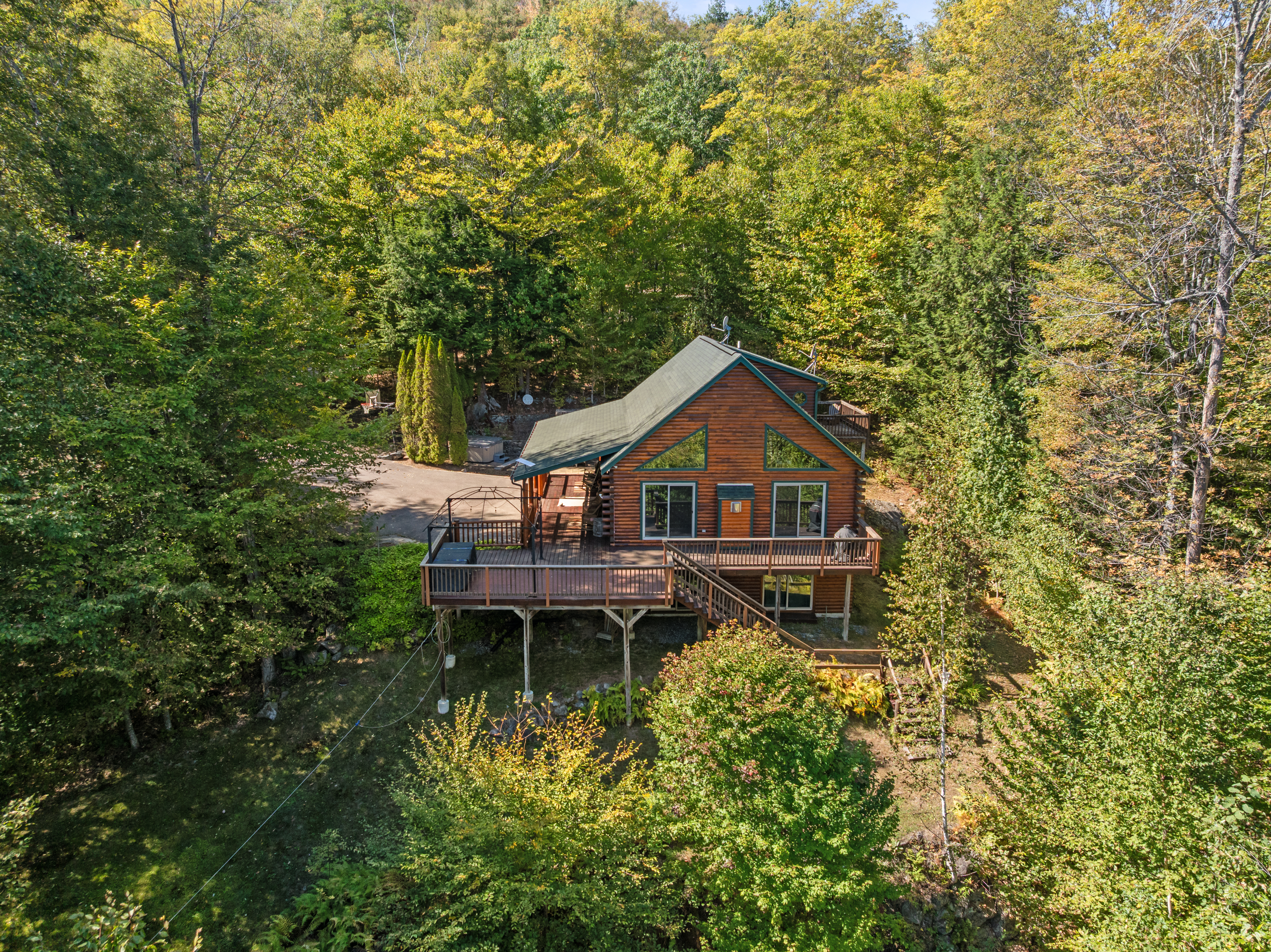 A log cabin near N.H. ski mountains is furnished and under $725K