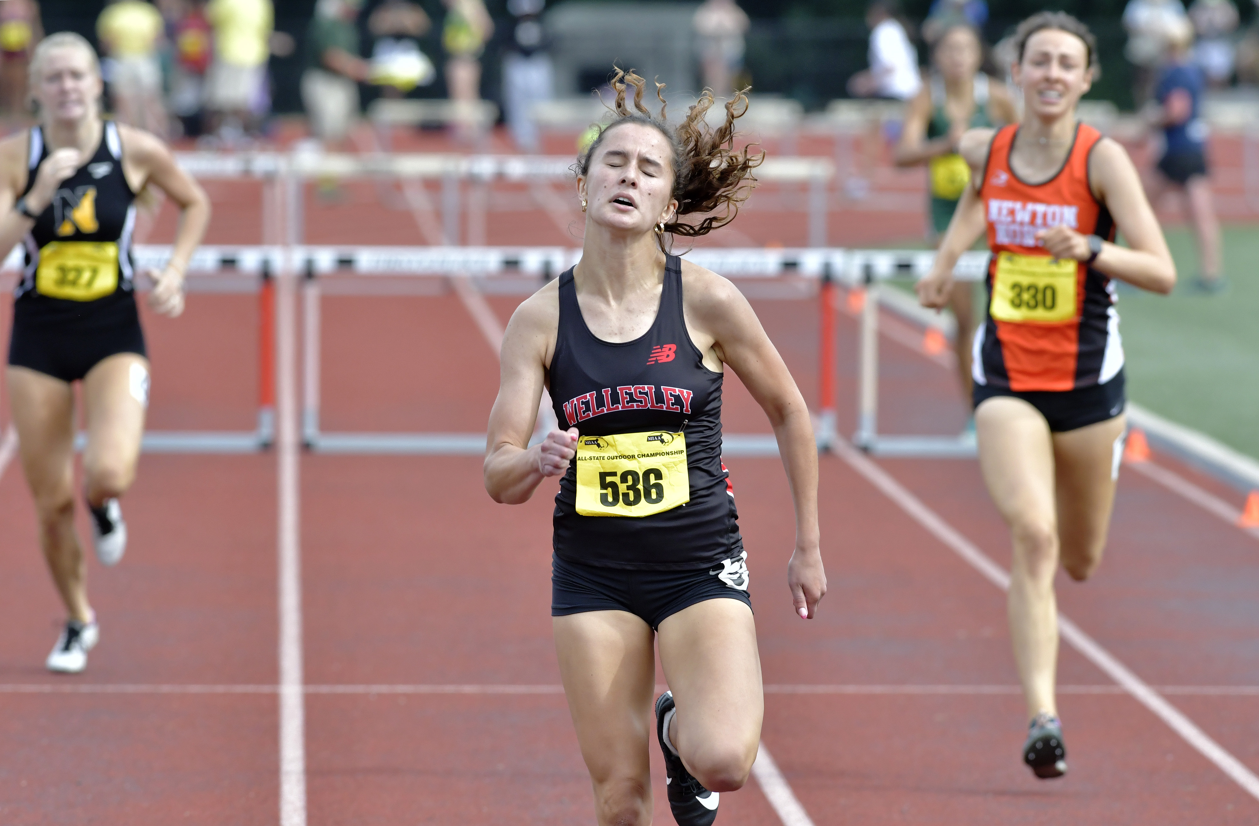 Megan Webb of Wellesley won the 400 meter hurdles by more than a second.