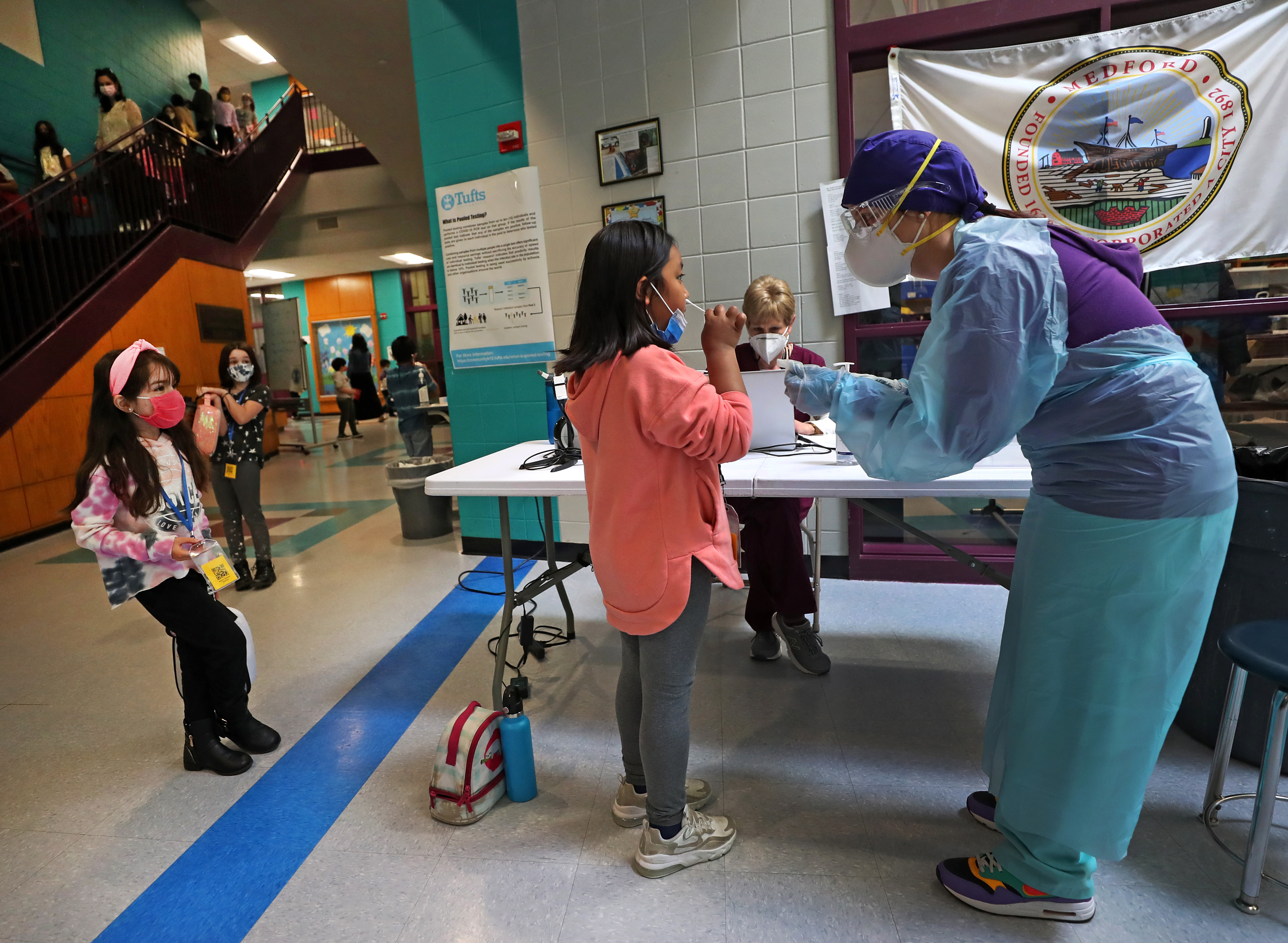 First-grade student Karma Yeshi got a swab test from RN Carla Constanza.