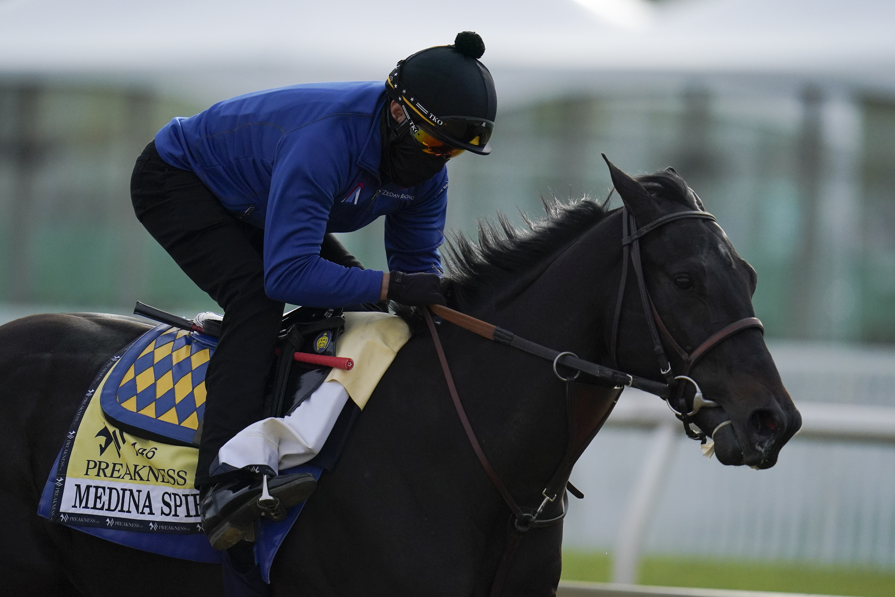 Exercise rider Humberto Gomez takes Medina Spirit around the track during a training session Wednesday.