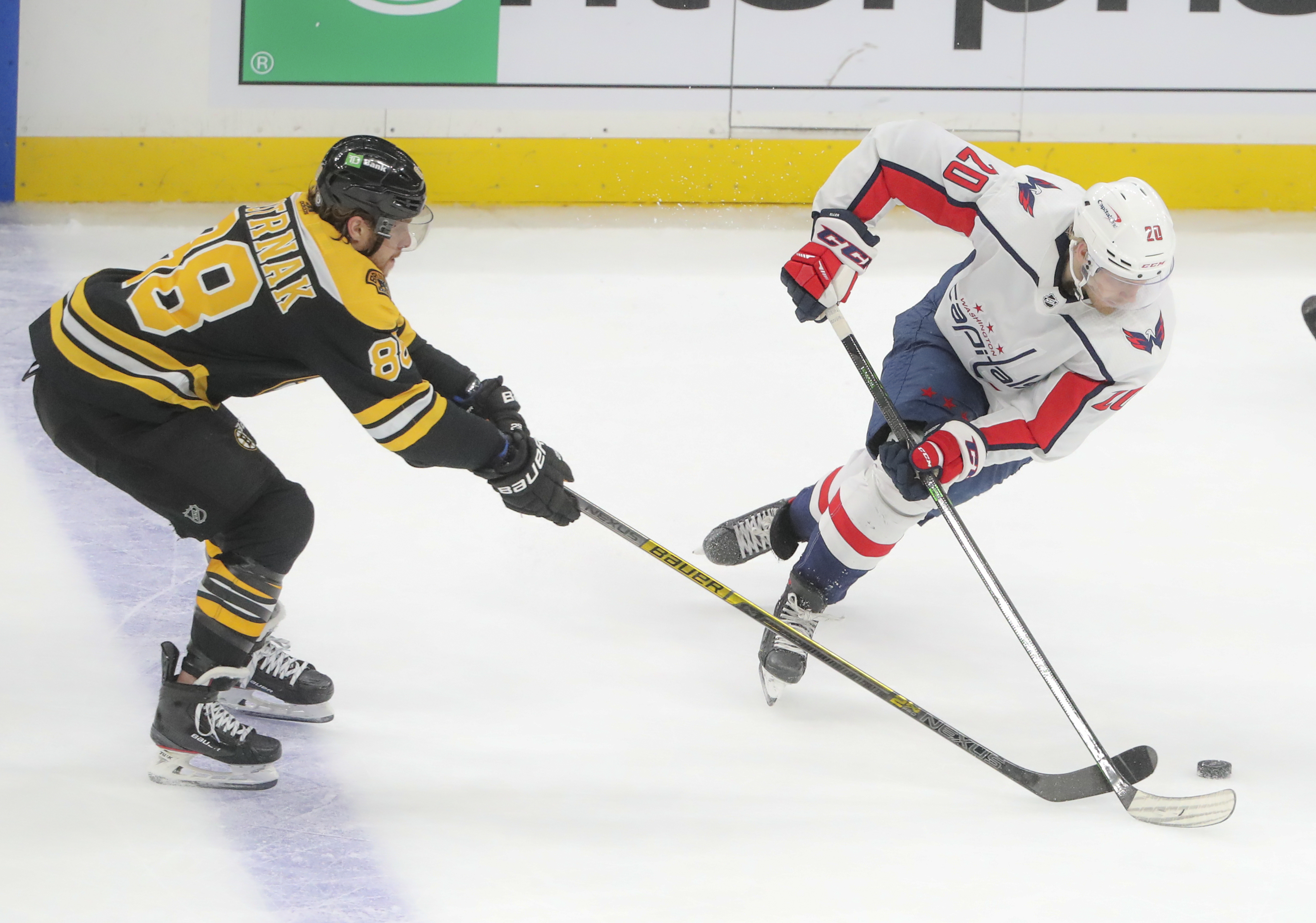 Bruins forward David Pastrnak loses the puck to Capitals center Lars Eller in Game 1.