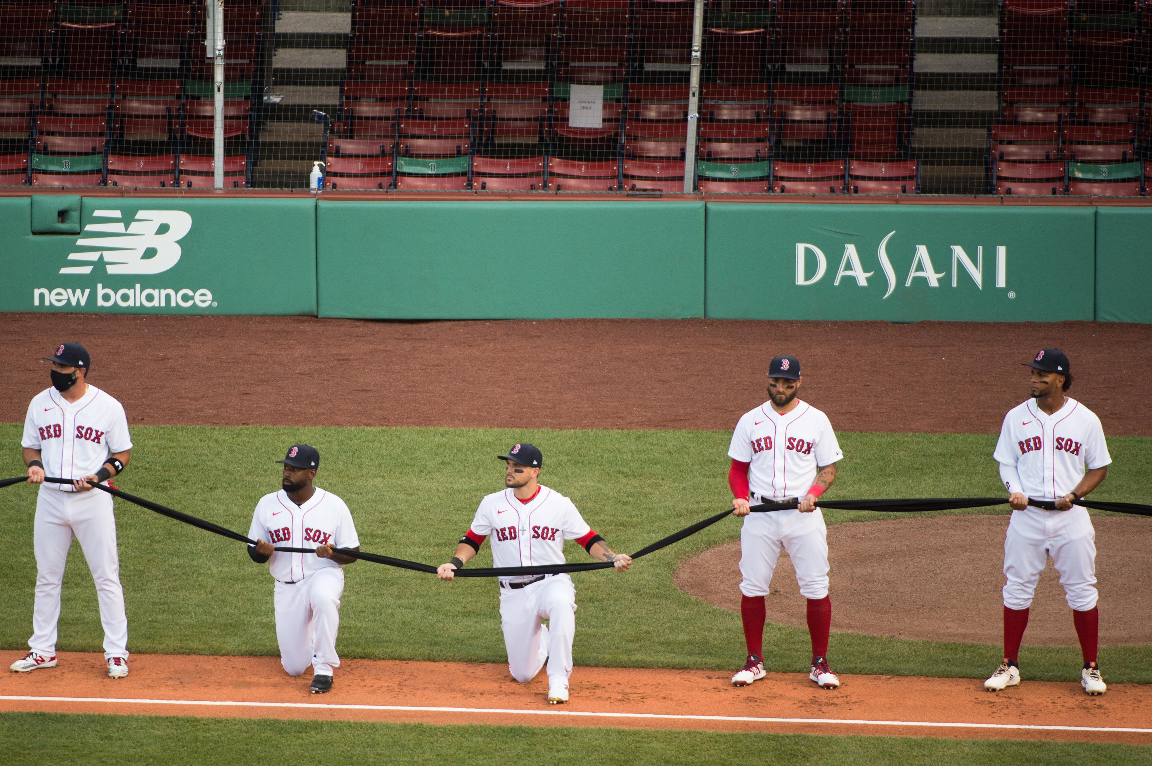 Red Sox players Jackie Bradley Jr. and Michael Chavis kneeled during the national anthem on Opening Day at Fenway Park in 2020.