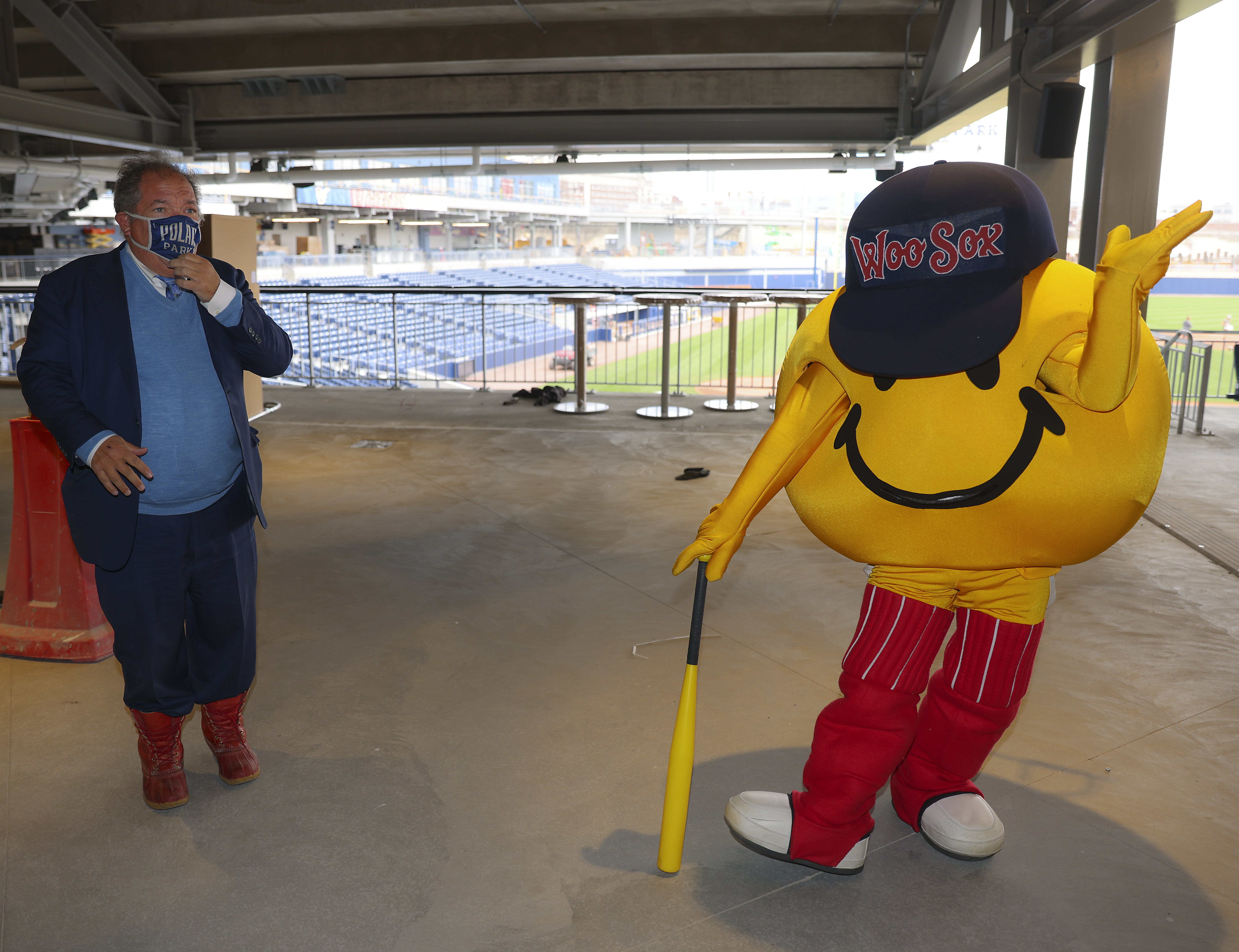 WooSox president Charles Steinberg and the team mascot, Smiley Ball.