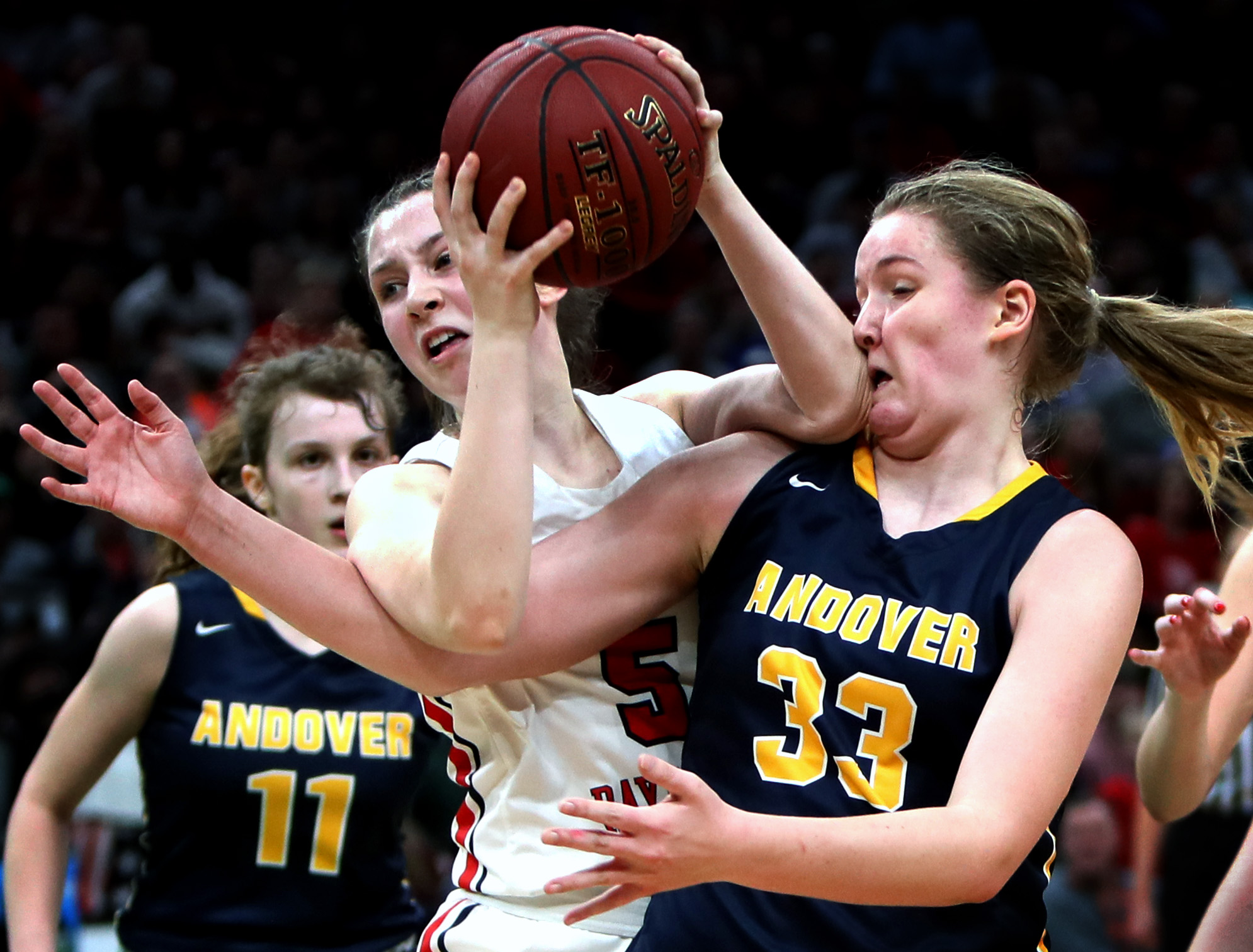 Bridgwater-Raynham’s Fiona Kelly, and Andover’s Anna Foley (33) battled for a rebound in the Division 1 girls’ basketball semifinal at TD Garden on March 10.