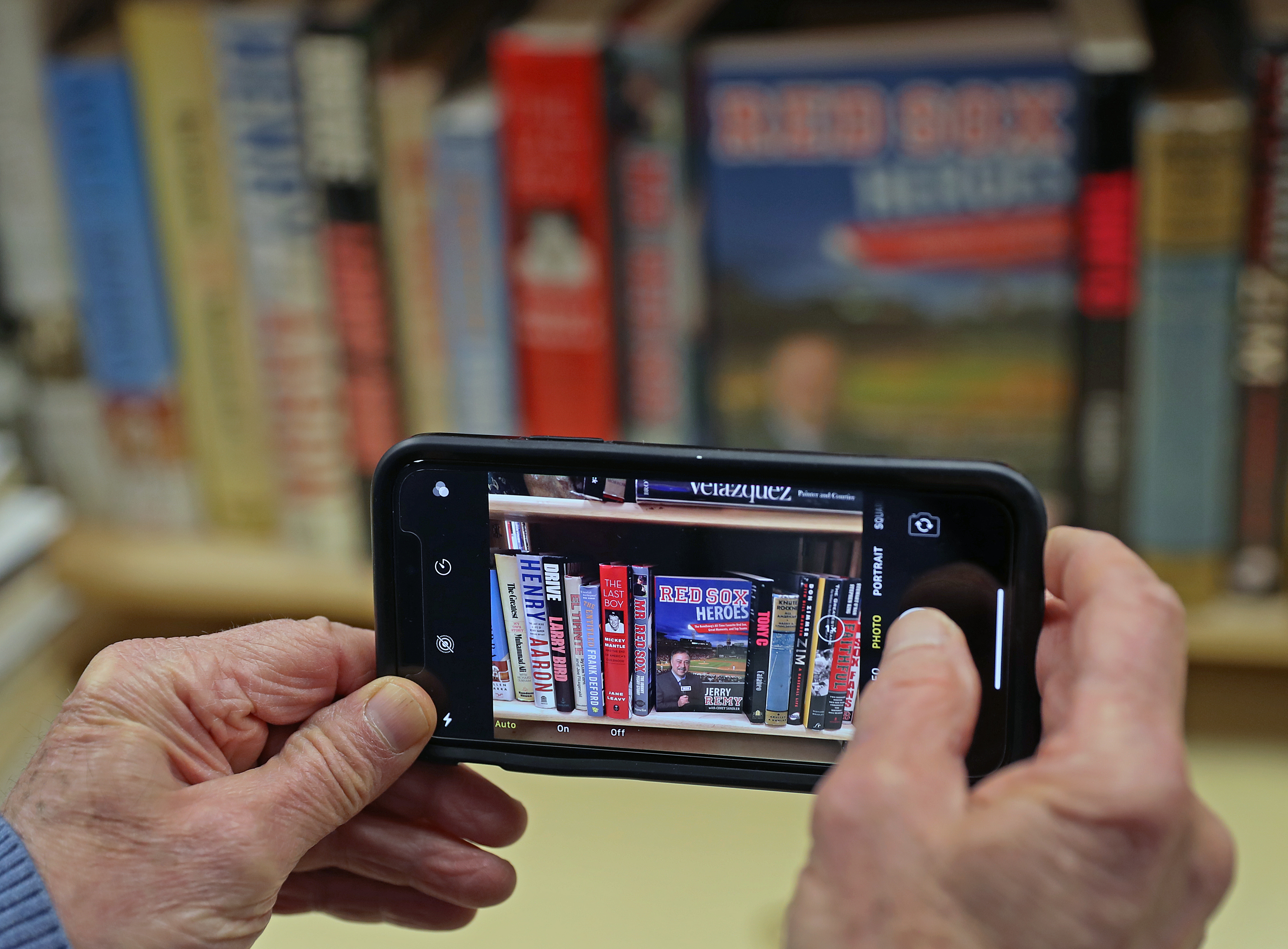 Ken Gloss took a photo of a Brattle Book Shop shelf for a customer to see.