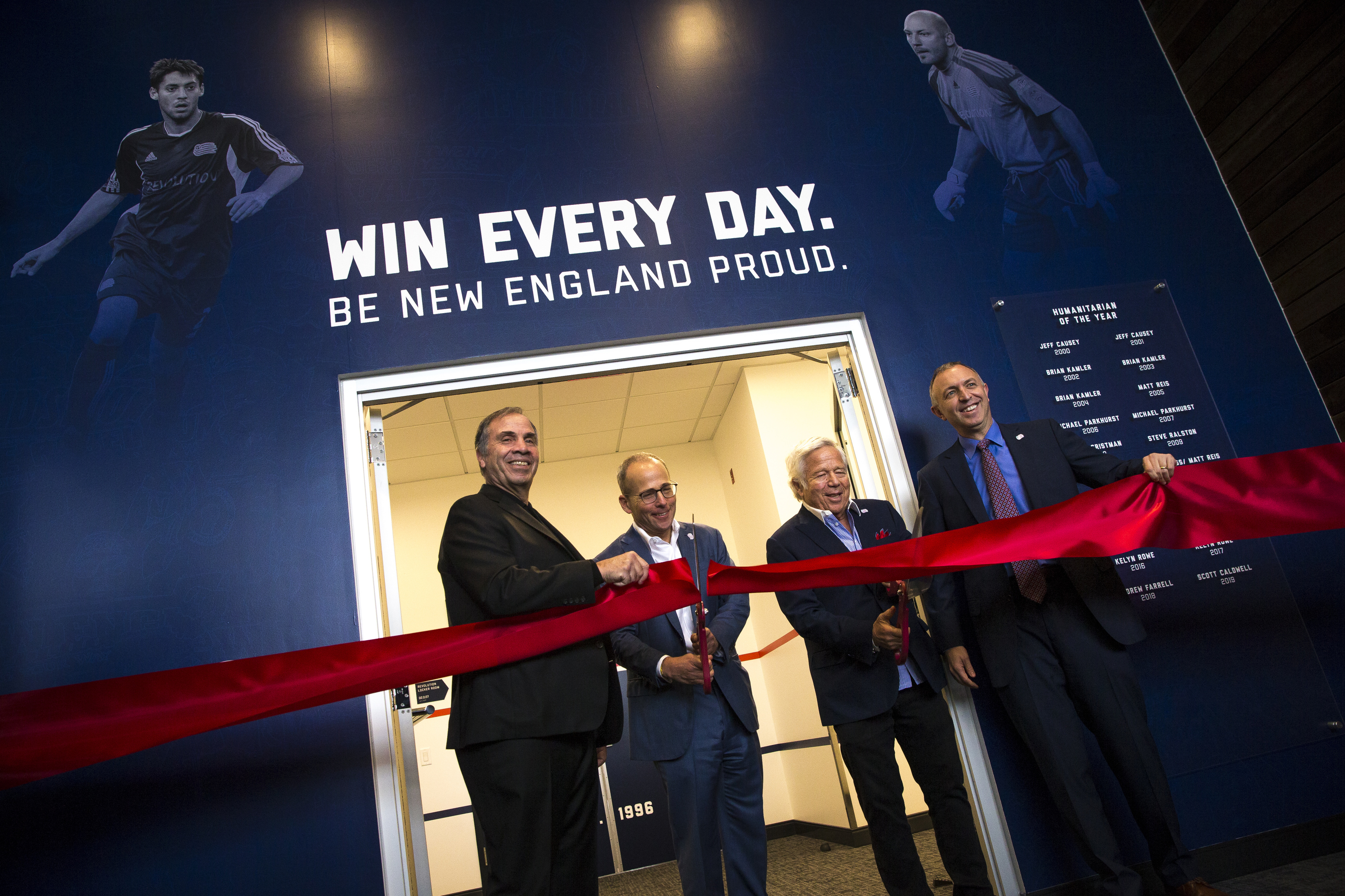 From left, coach Bruce Arena, owners Jonathan and Robert Kraft,and team president Brian Bilello cut the ribbon to formally open the Revolution Training Center in 2019.