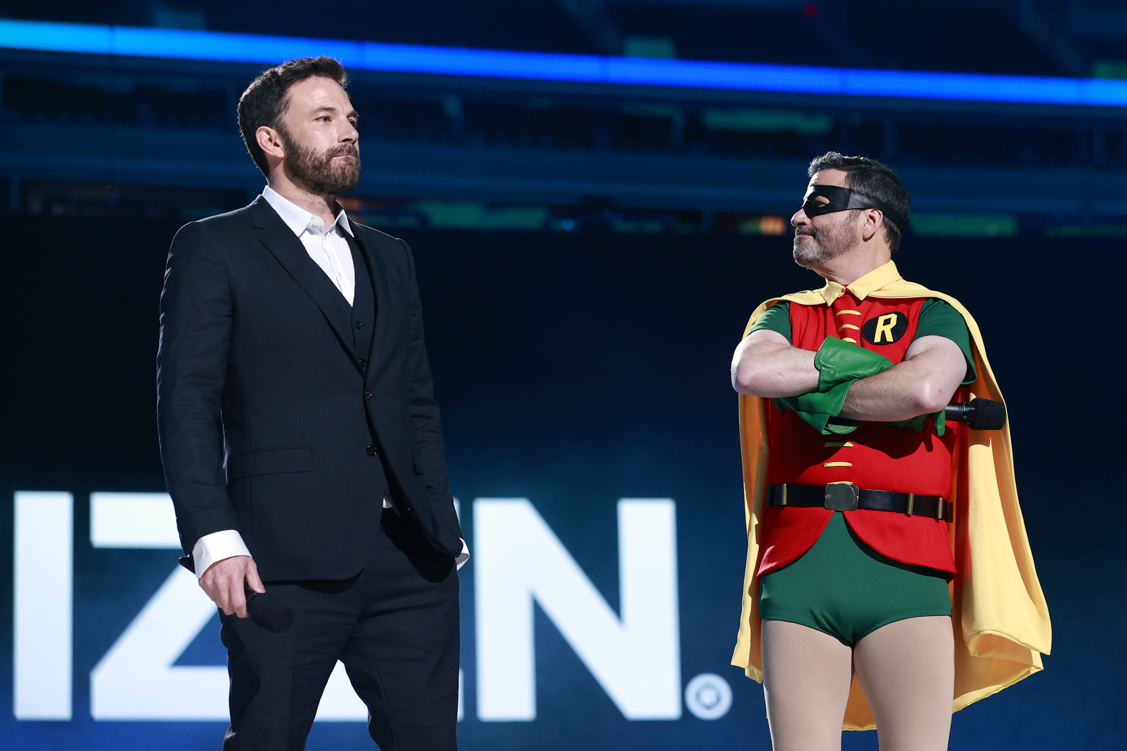 Ben Affleck and Jimmy Kimmel (in costume as Robin) spoke onstage during Global Citizen's "Vax Live" concert.