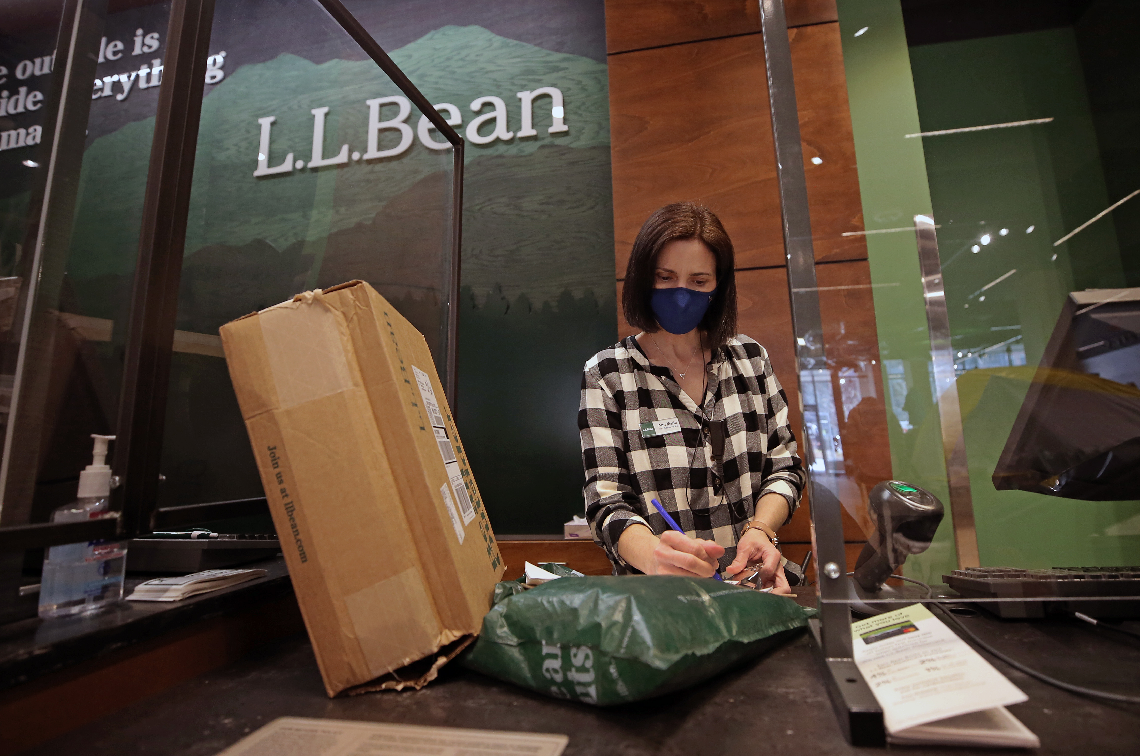 Ann Marie Palmer, manager at the L.L.Bean store in Boston's Seaport, checked packages for online customers.