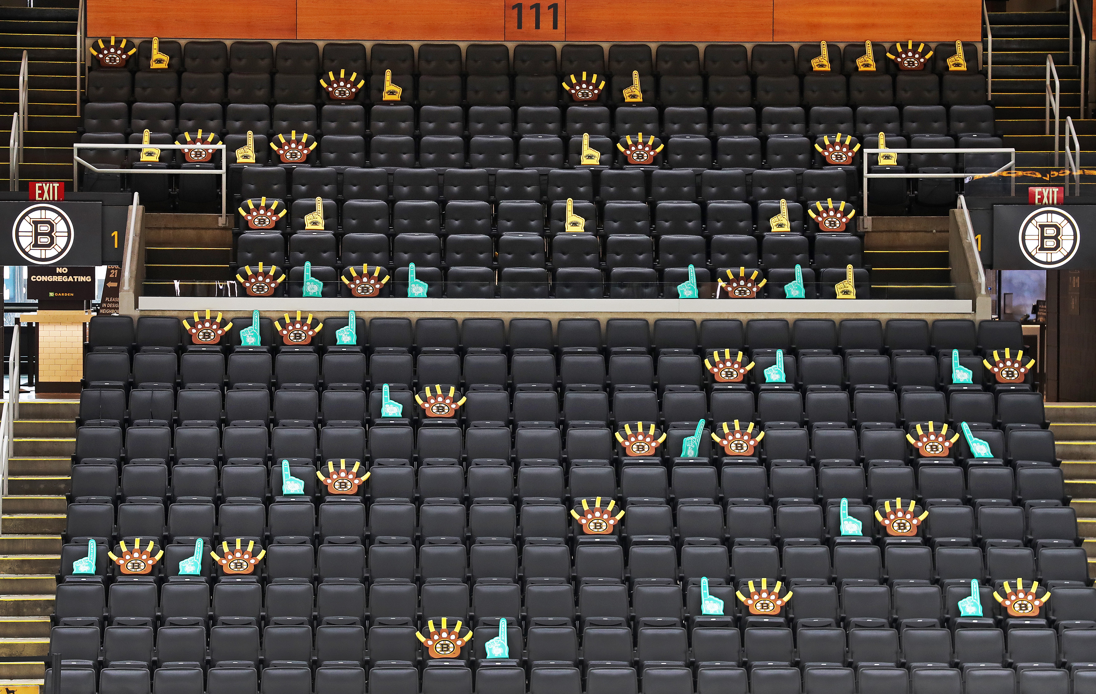The foam fingers (with Bruins and Celtics logos) represent the seats where fans will be allowed to sit. The other seats are off-limits.