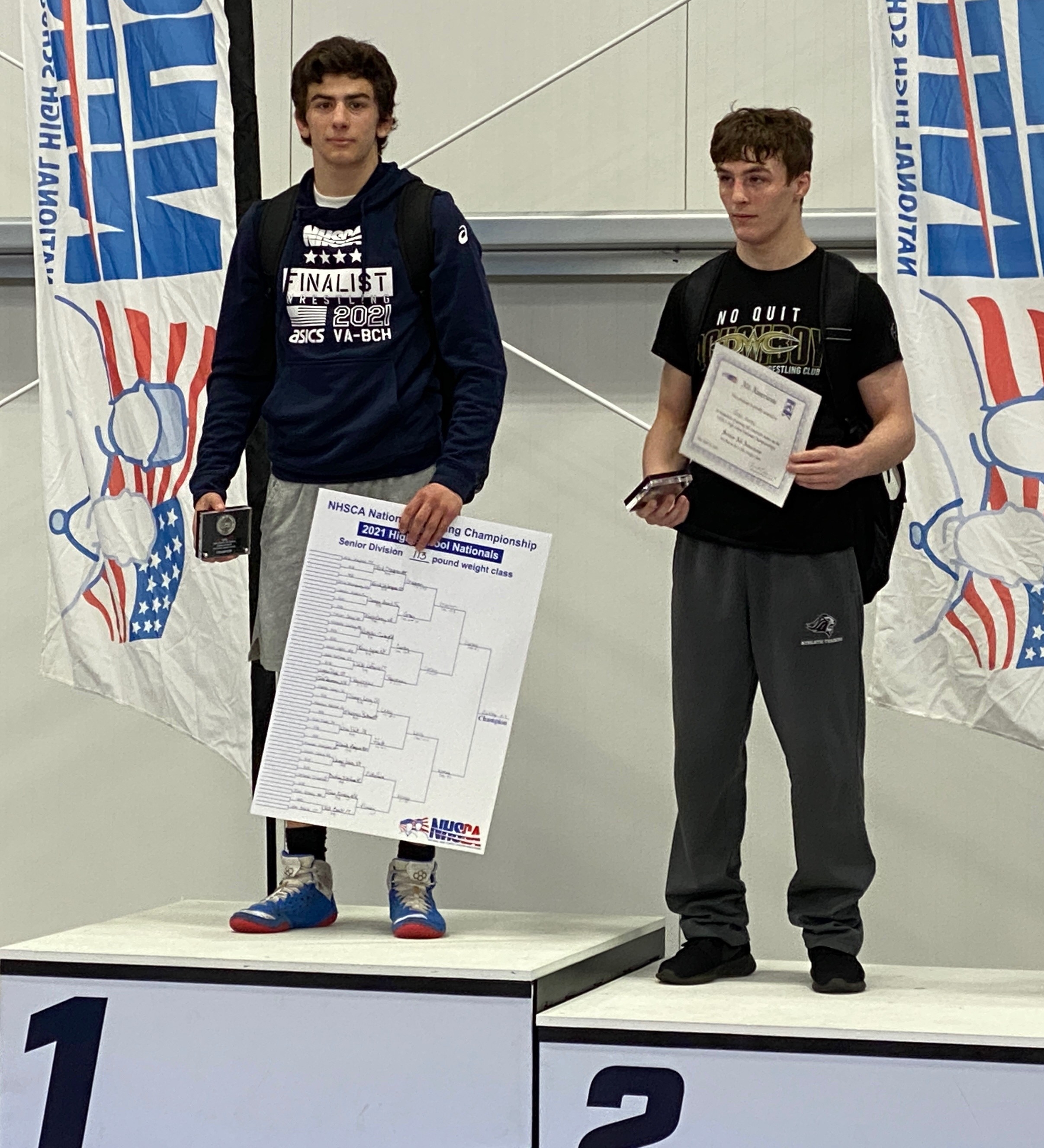 St. John's Prep senior Nick Curley (left) defeated Chelmsford's Evan Kinney (right) in the national final at 113 pounds with an 11-7 victory.