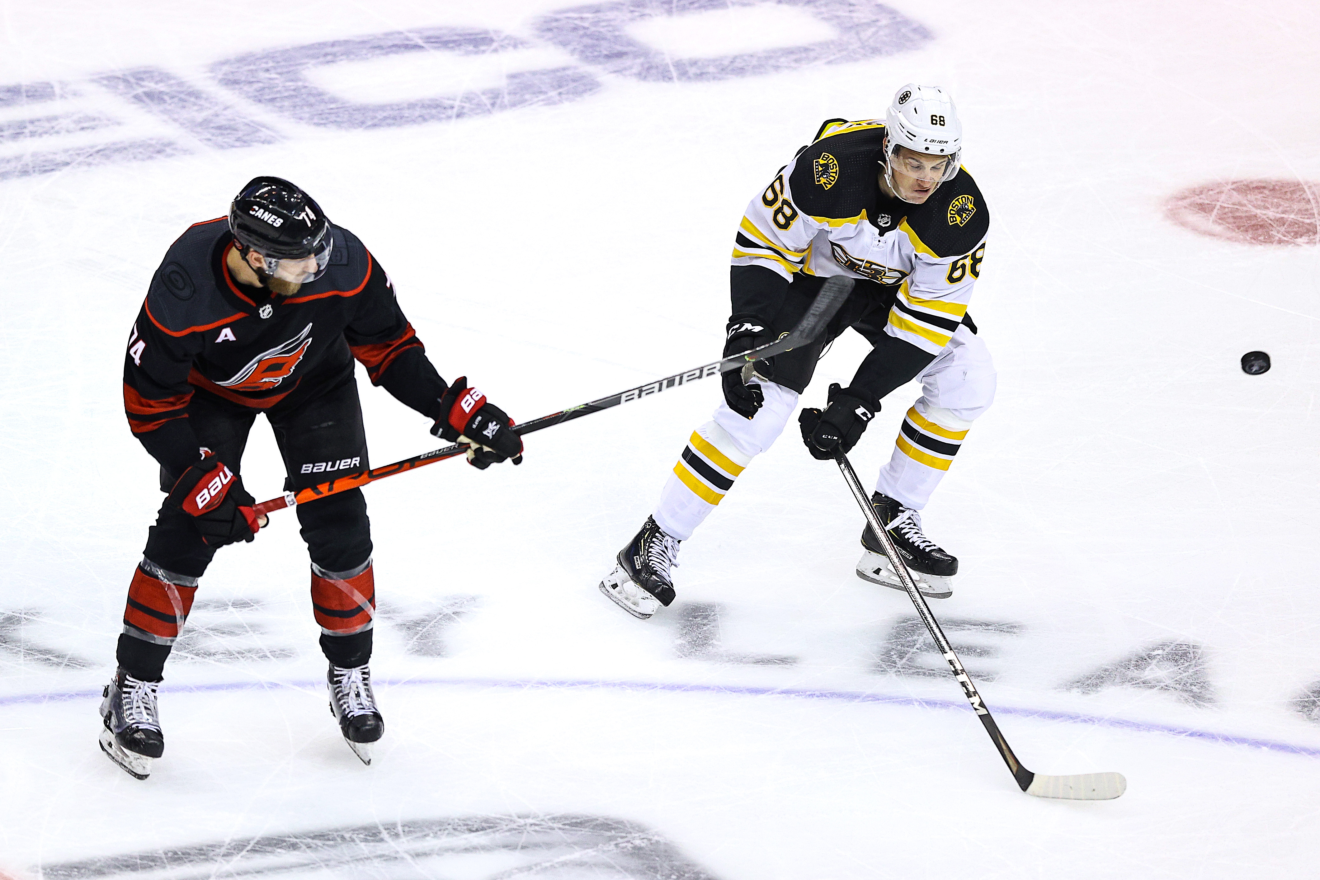 Jack Studnicka defends against Carolina's Jaccob Slavin in a playoff contest earlier this summer.