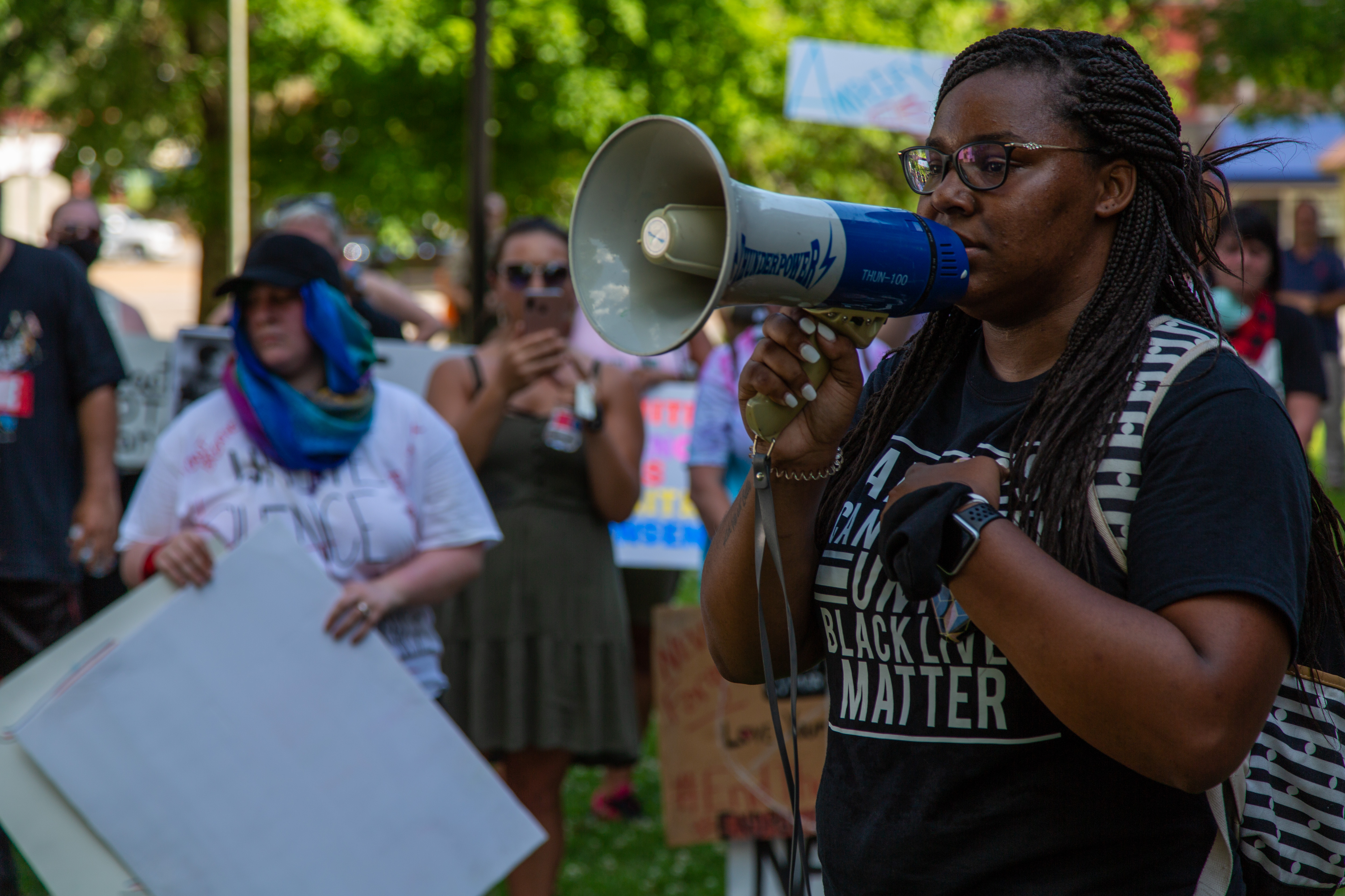 Maya Hood, one of the few Black participants in the Harrison rally, spoke to protesters.