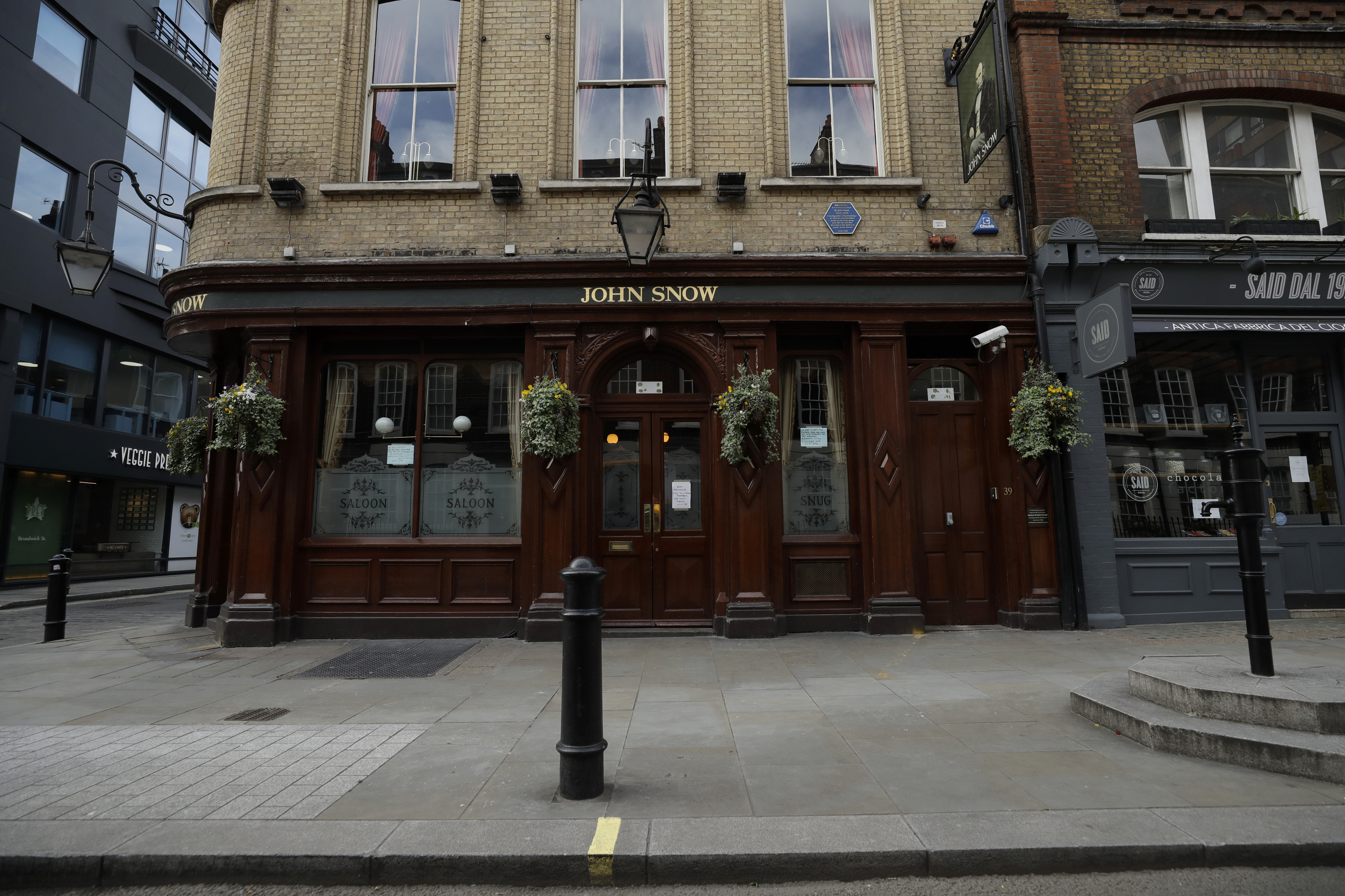 The John Snow pub in London, with a replica of the original water pump that Dr. Snow identified as the source of a cholera outbreak in 1848.