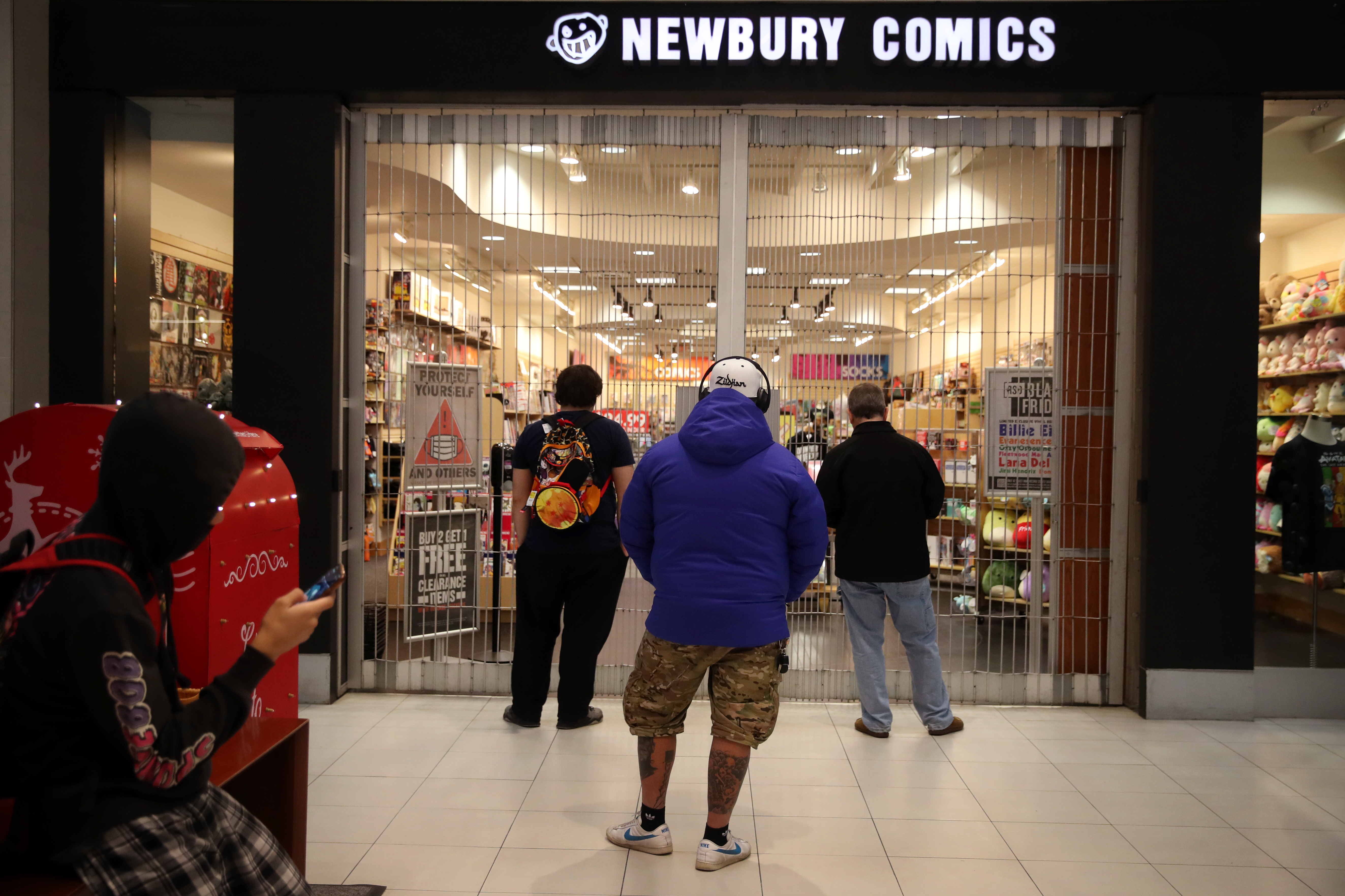 Shoppers wait for Newbury Comics to open on Black Friday.