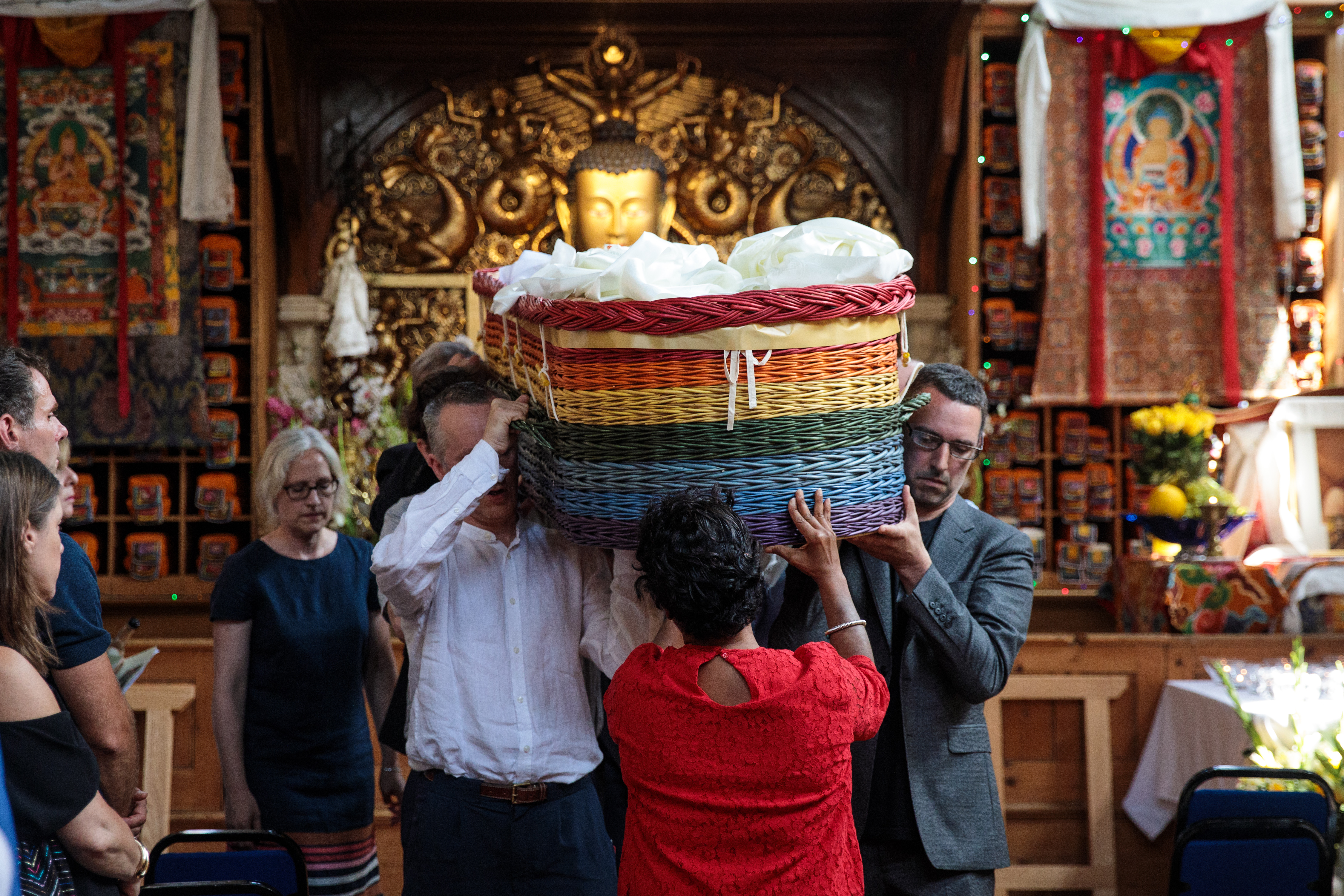 Relatives carry the willow coffin of Death Café founder Jon Underwood on July 6, 2017 in London. The movement lives on, bringing people together to talk freely and openly about dying and death.