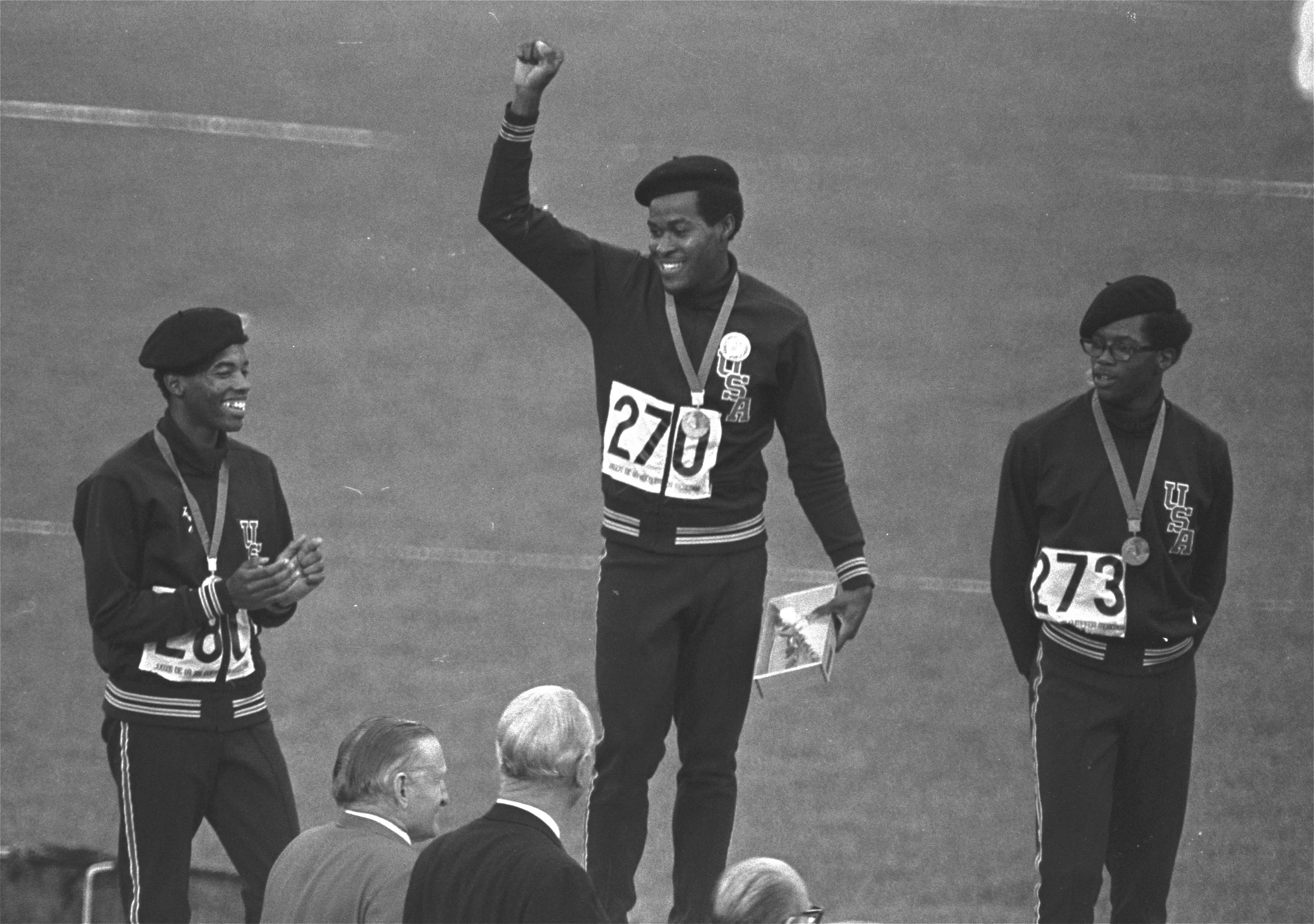Lee Evans (center) on the medal podium after winning the Olympic 400 meters in Mexico City. 