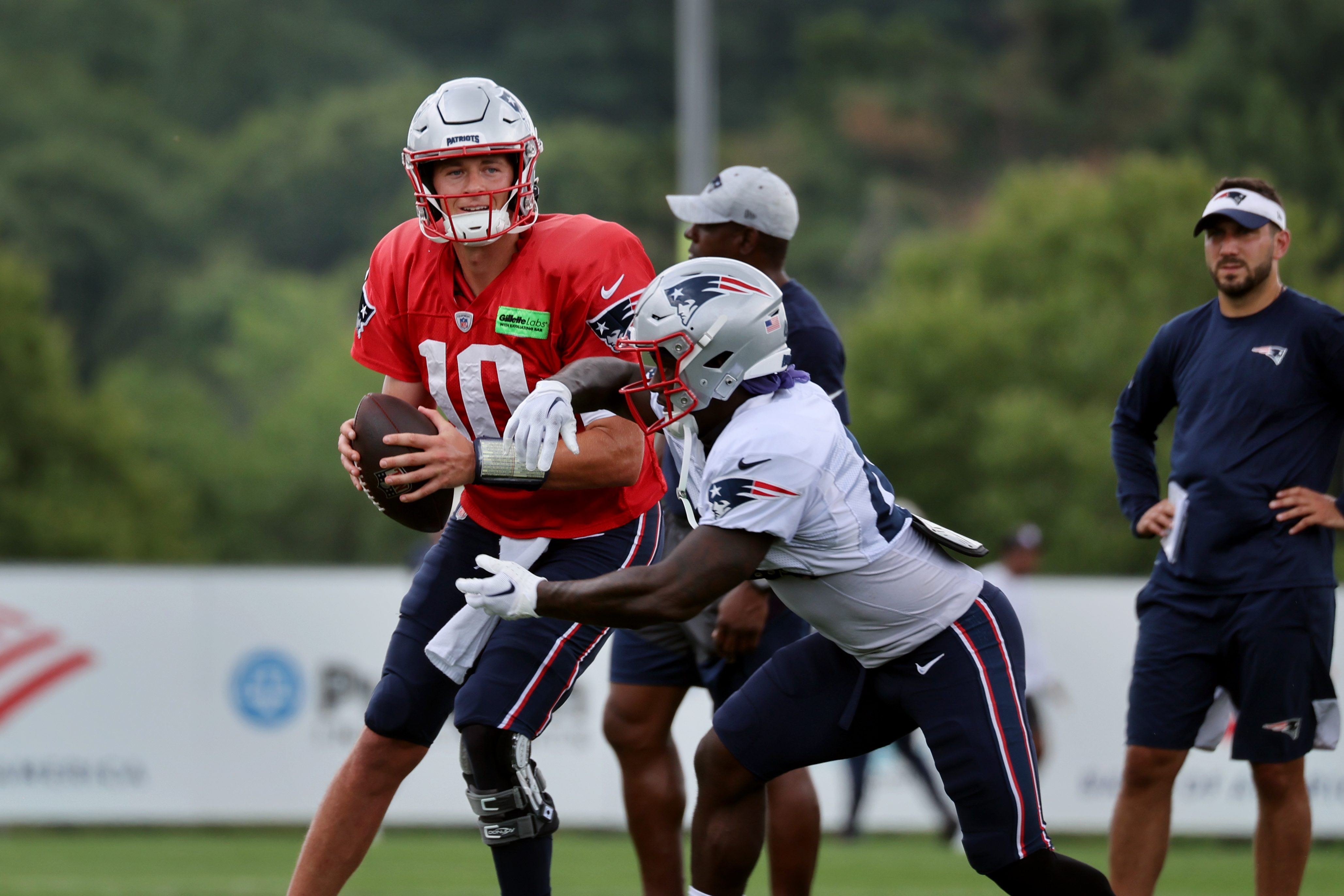 Mac Jones New England Patriots Unsigned Loading to Pass Photograph