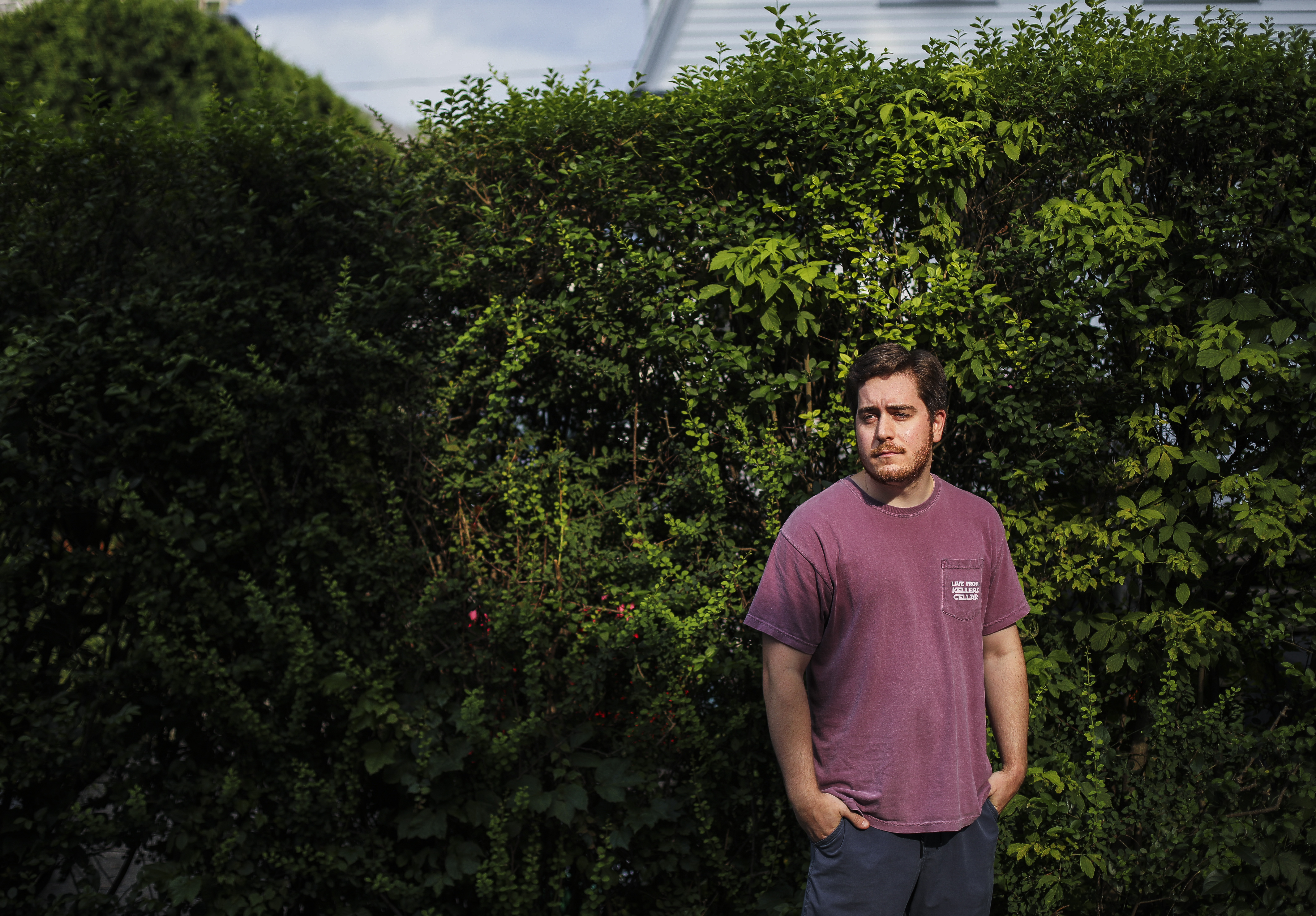 Ryan Page in the yard outside his Waltham apartment.