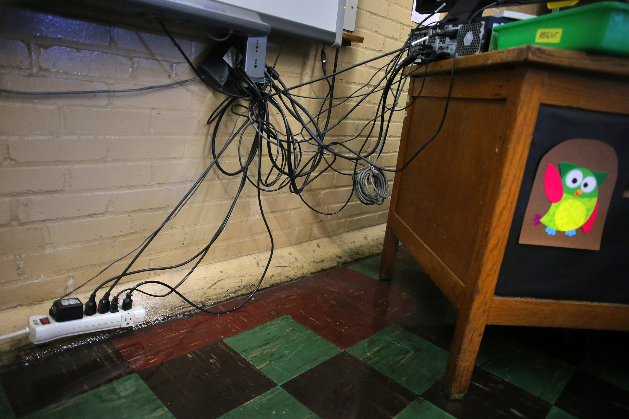 A lack of outlets in a basement classroom at the Pickering Middle School in Lynn in 2019. The cash-strapped city has struggled to update and replace its tumbledown schools.