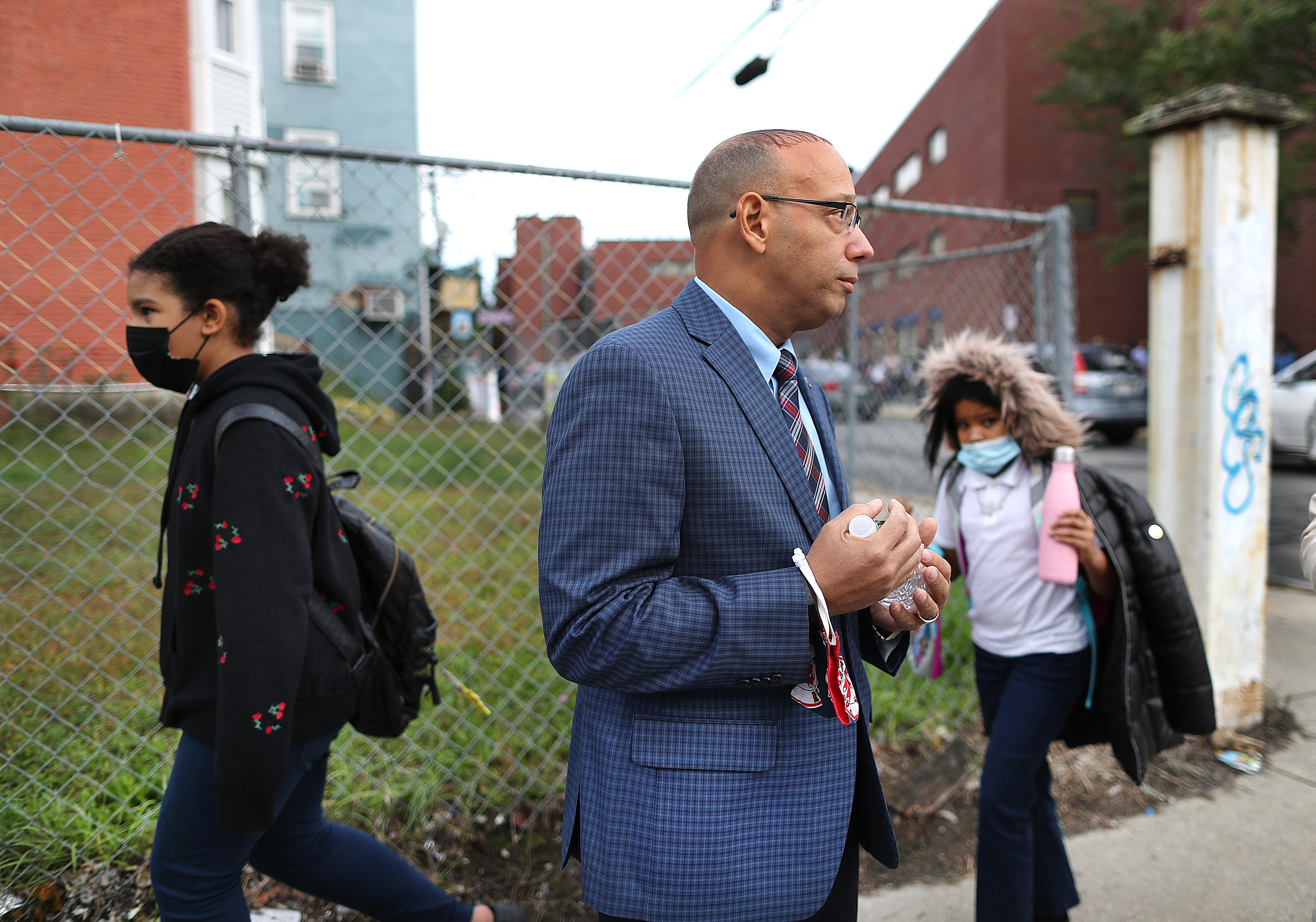 State Representative Frank Moran watched as students from a Lawrence elementary school went home for the day.