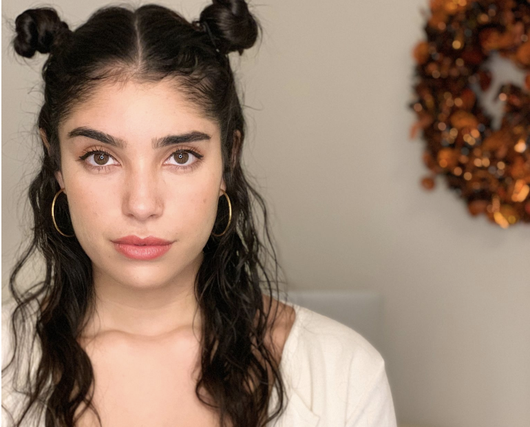 Amanda Figueroa as lifestyle blogger Emma Herrera in "A Very Herrera Holiday."