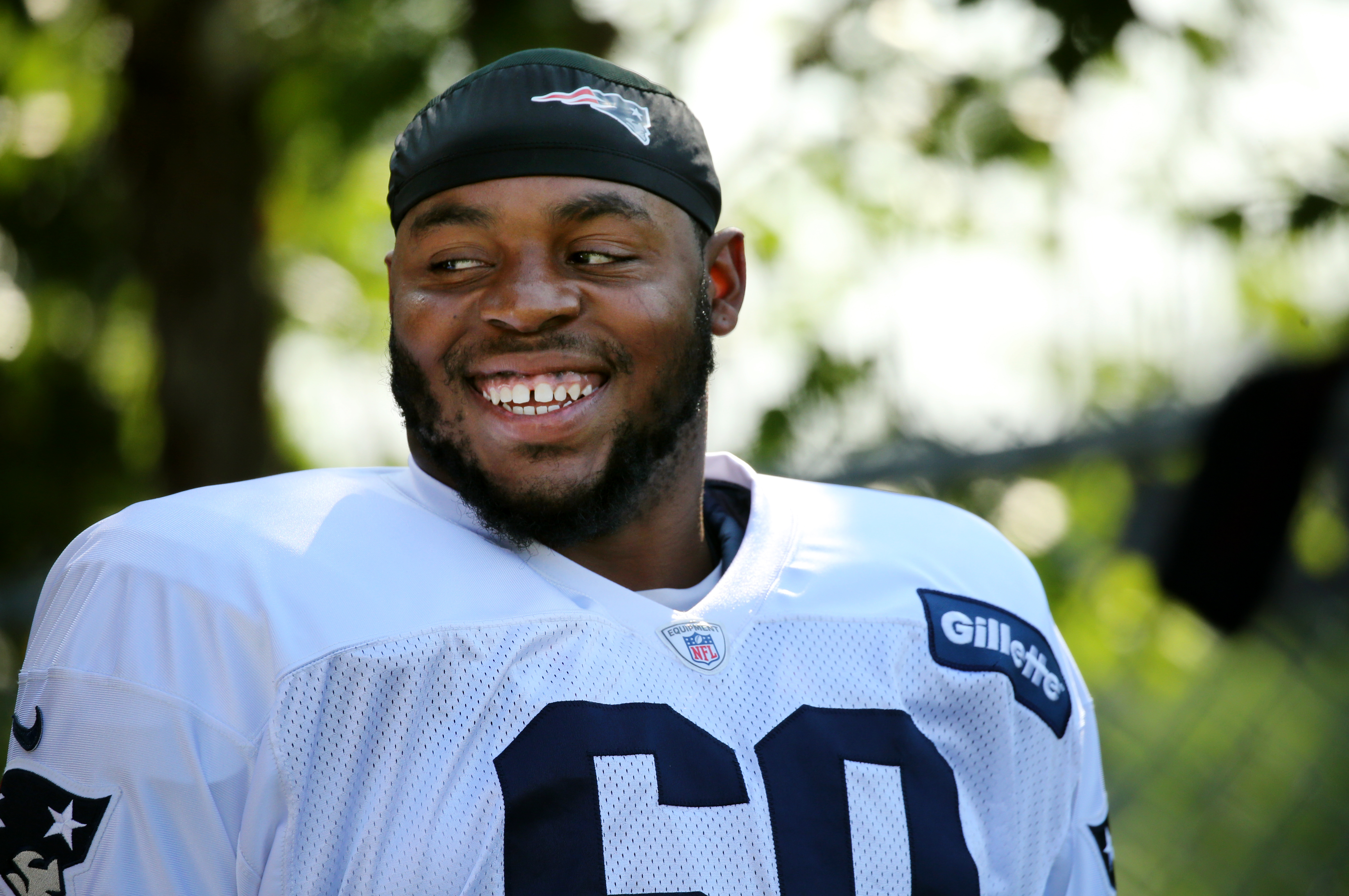 Shaq Mason takes the field before a training camp workout in Foxborough.
