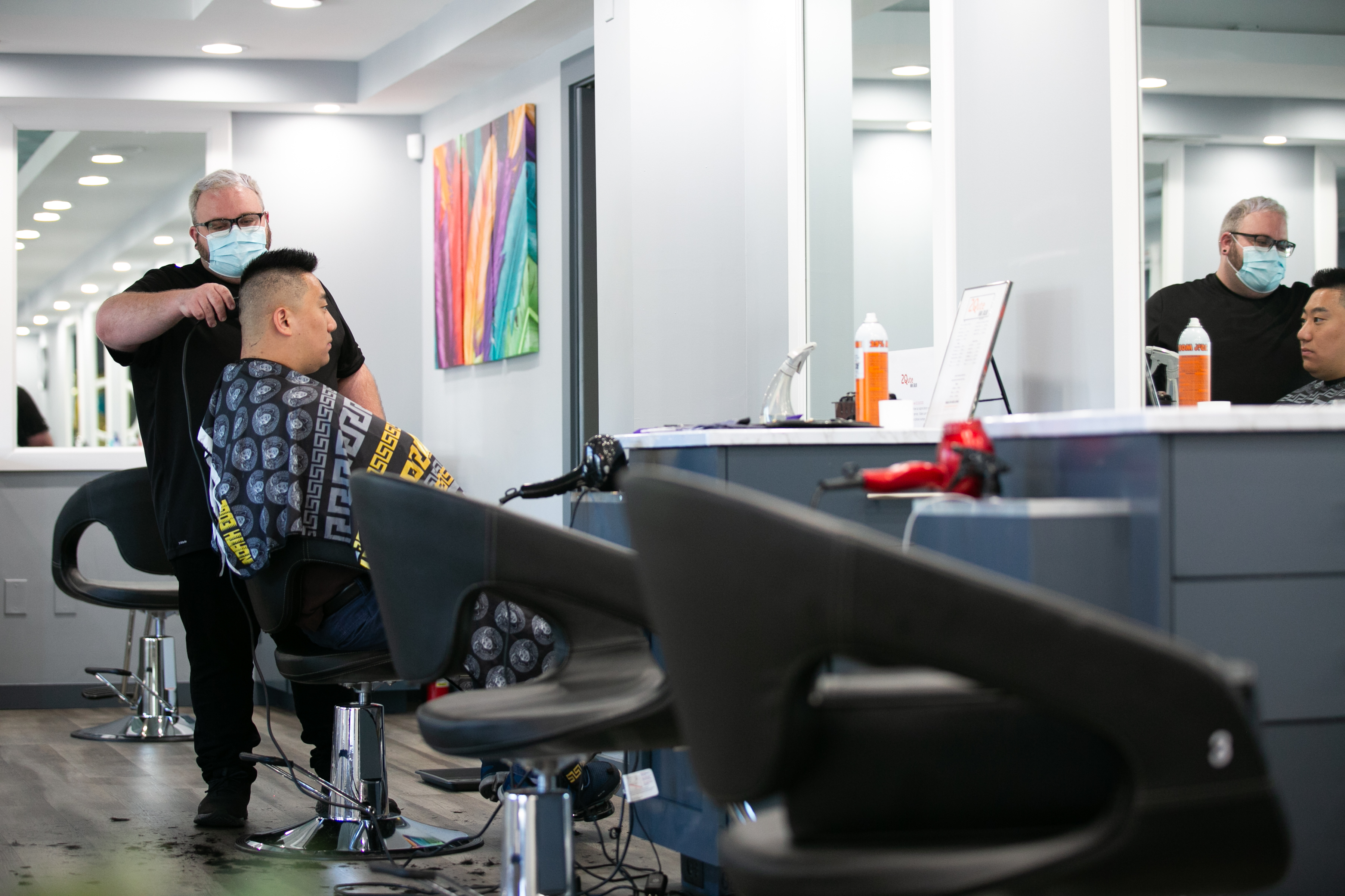 Harris Little cuts Matt Kim's hair at 2Qute Hair Salon on April 27 in Atlanta.