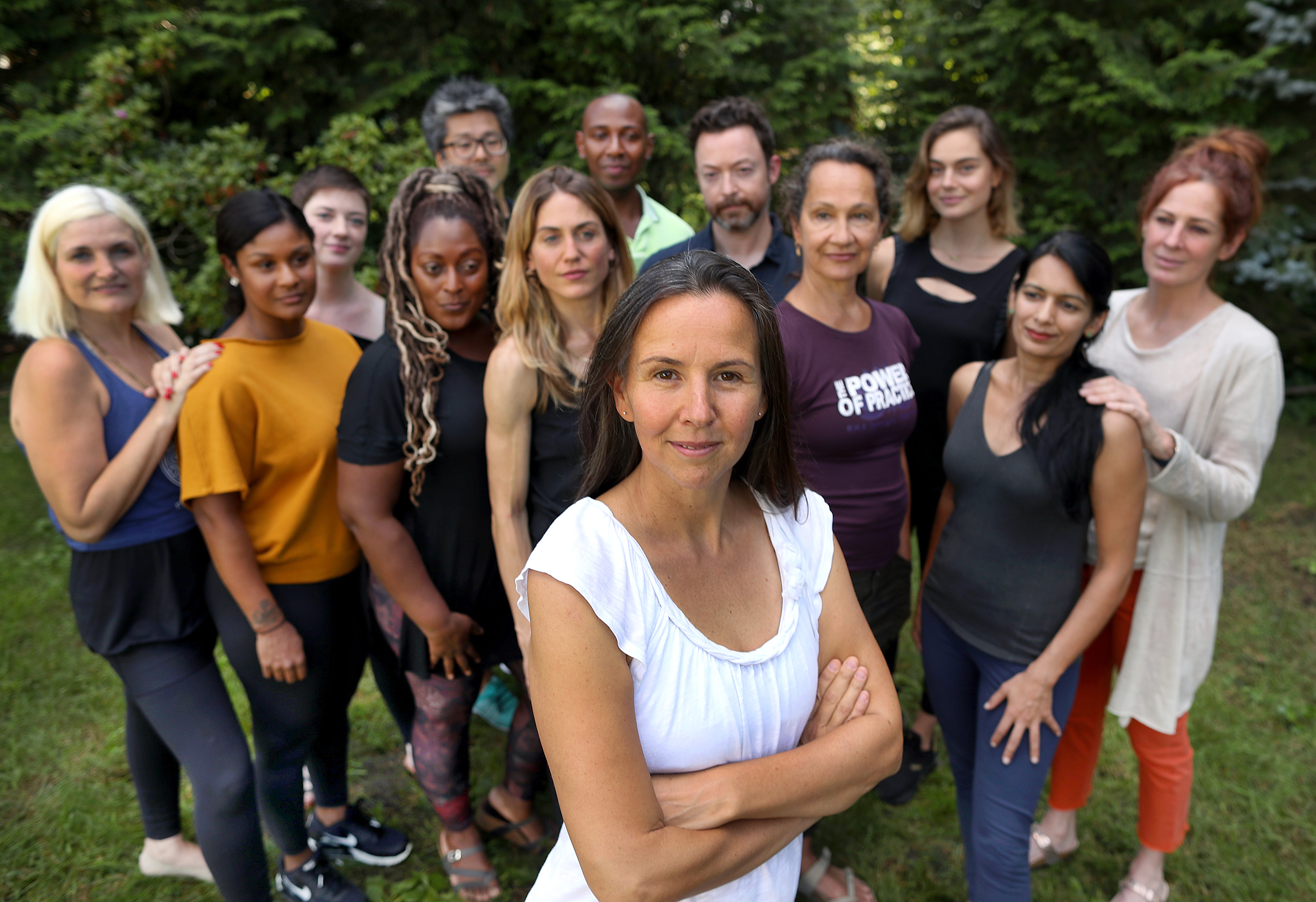 Down Under School of Yoga owner Justine Wiltshire Cohen (center) in her backyard with her New Teachers Leadership Council.