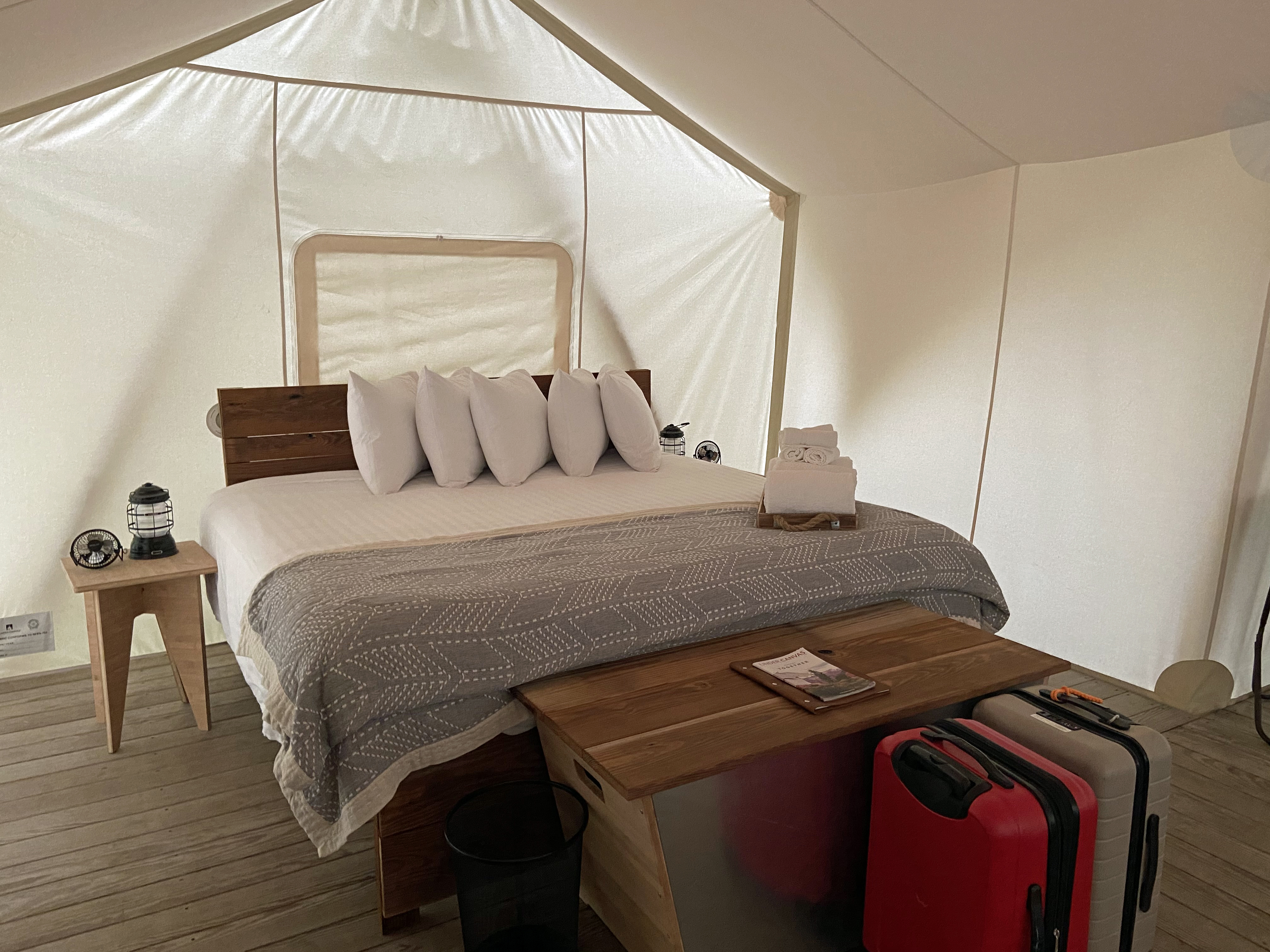 No sleeping bags in these tents, just a woodstove, a bathroom, and furnishings from West Elm.