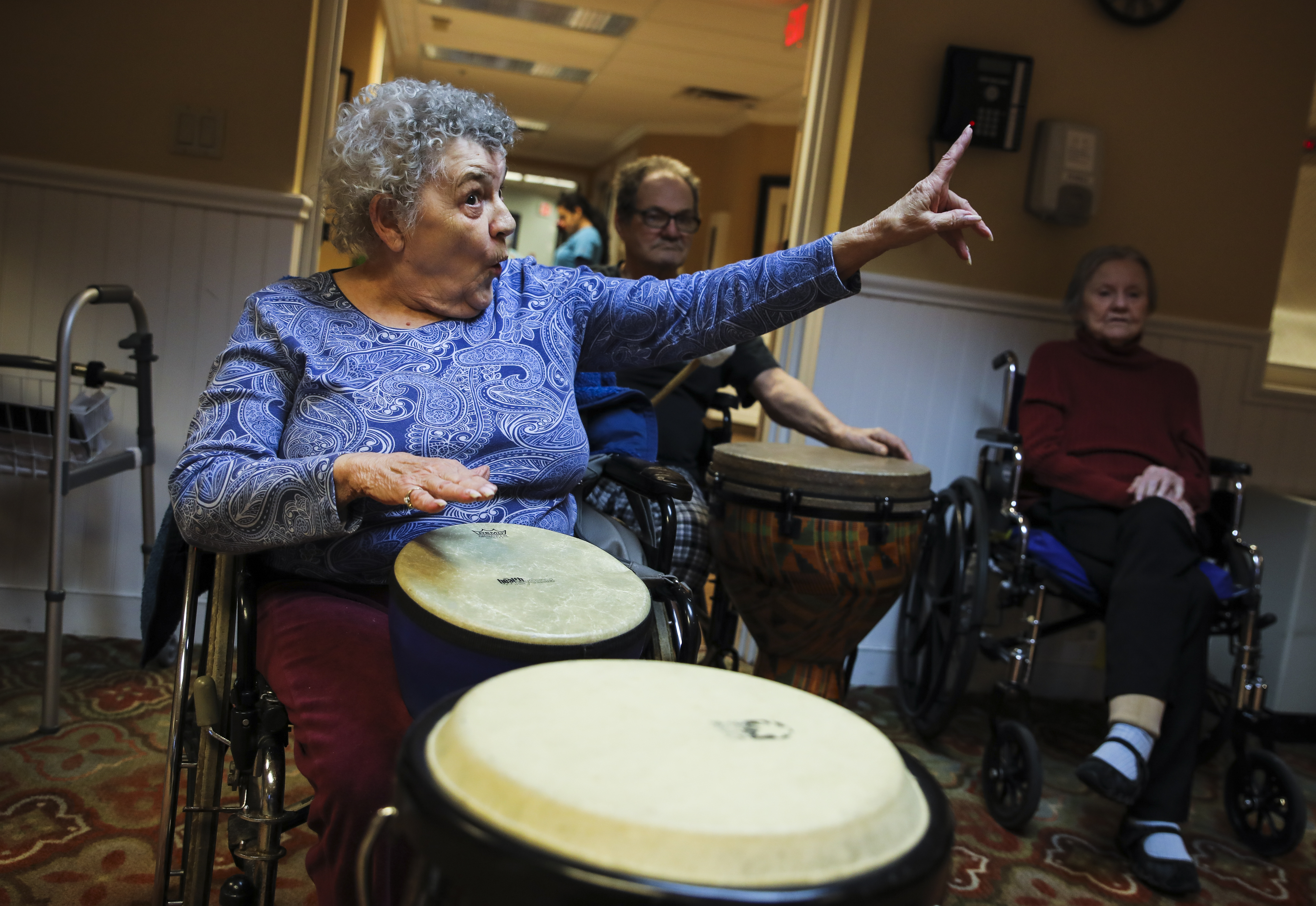 Gloria Donahue sang Christmas carols in a drum circle led by David Currier at Life Care Centers of the North Shore in Lynn.