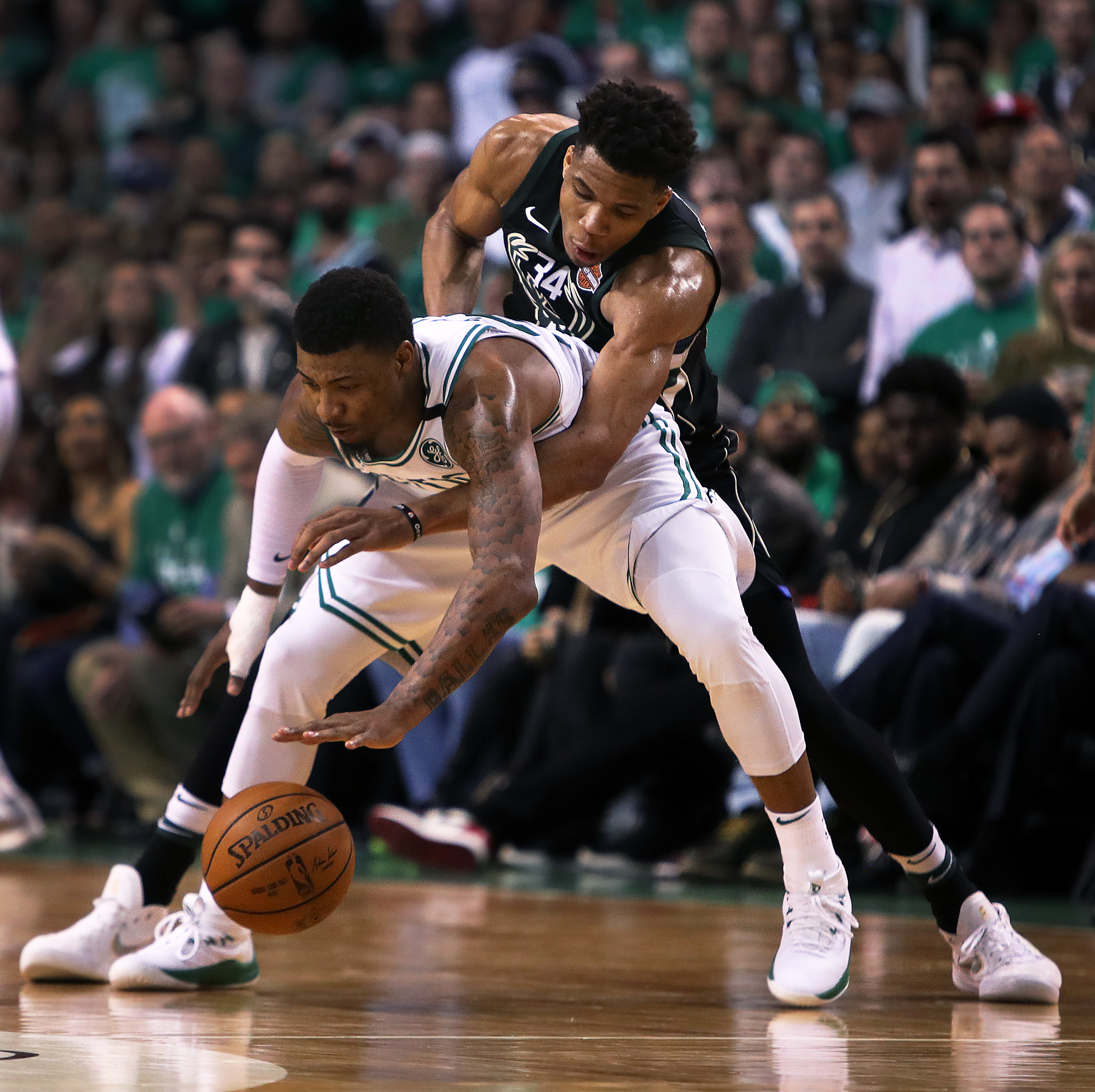 Giannis Antetokounmpo can't get a steal from Marcus Smart during Game 5 of the first round of the 2018 playoffs.