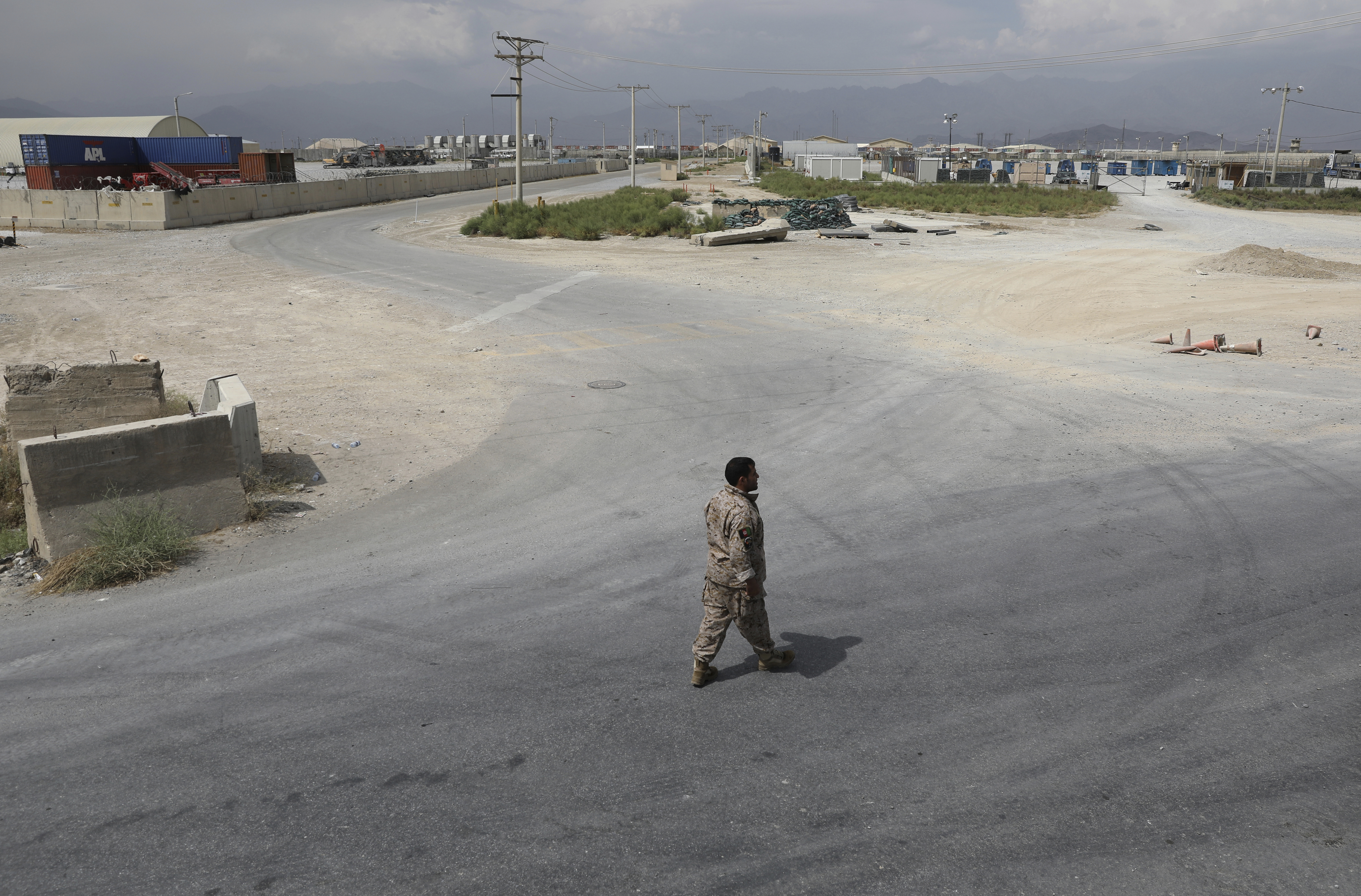 On July 5, a member of the Afghan security forces walked through the Bagram air base after the American military departed.