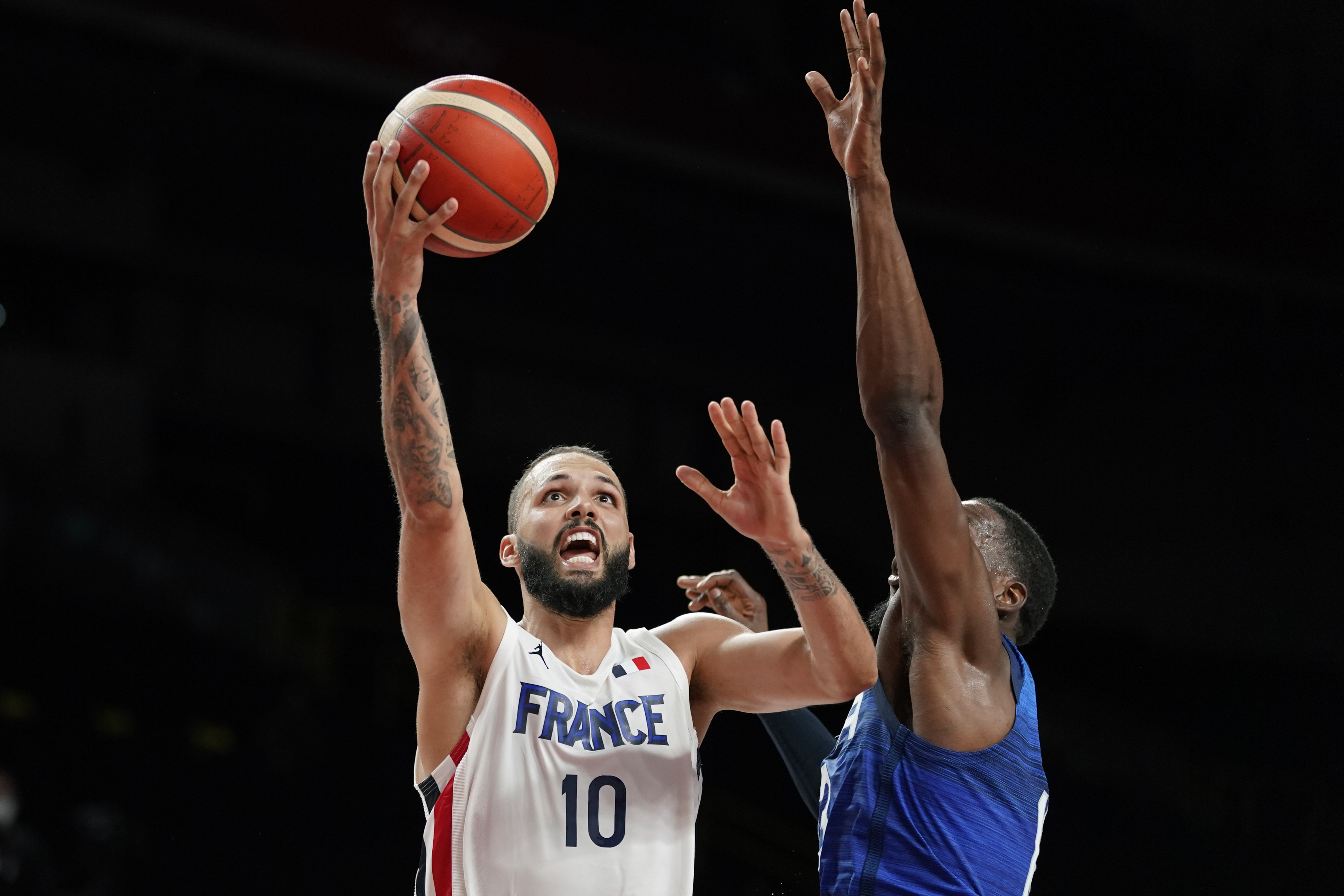 Evan Fournier drives to the basket past Bam Adebayo during France's win over the United States.