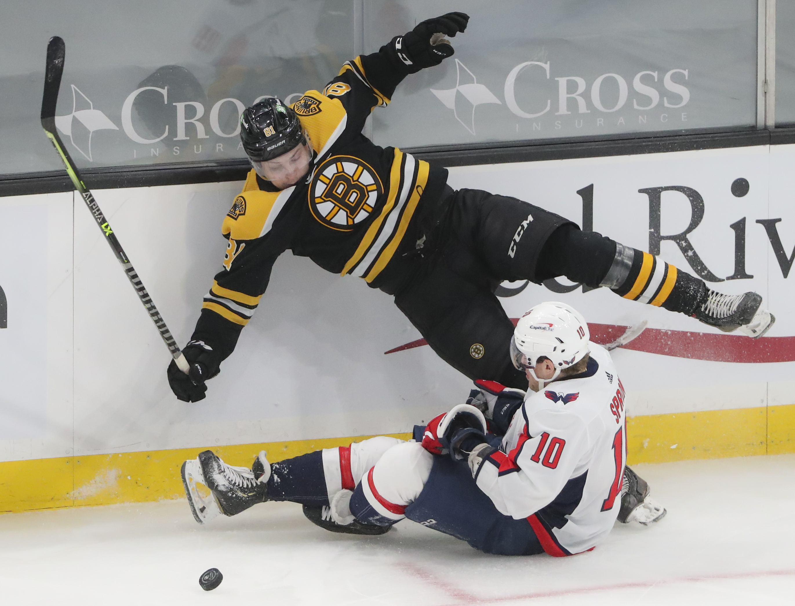 Jarred Tinordi is upended by Washington's Daniel Sprong during first-period action Sunday night.
