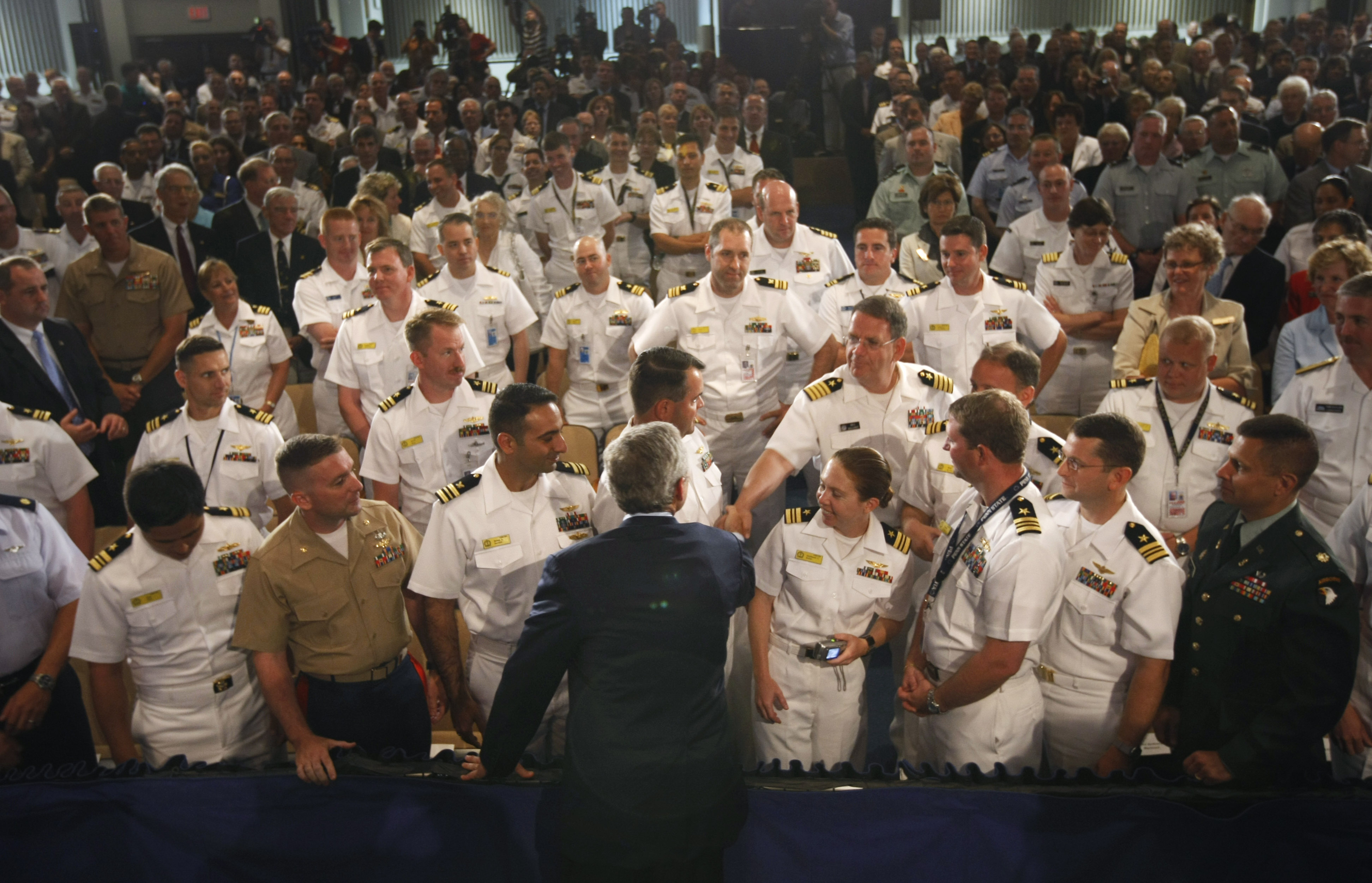 President George W. Bush shook hands with audience members after delivering a speech at the Naval War College in Newport, R.I.