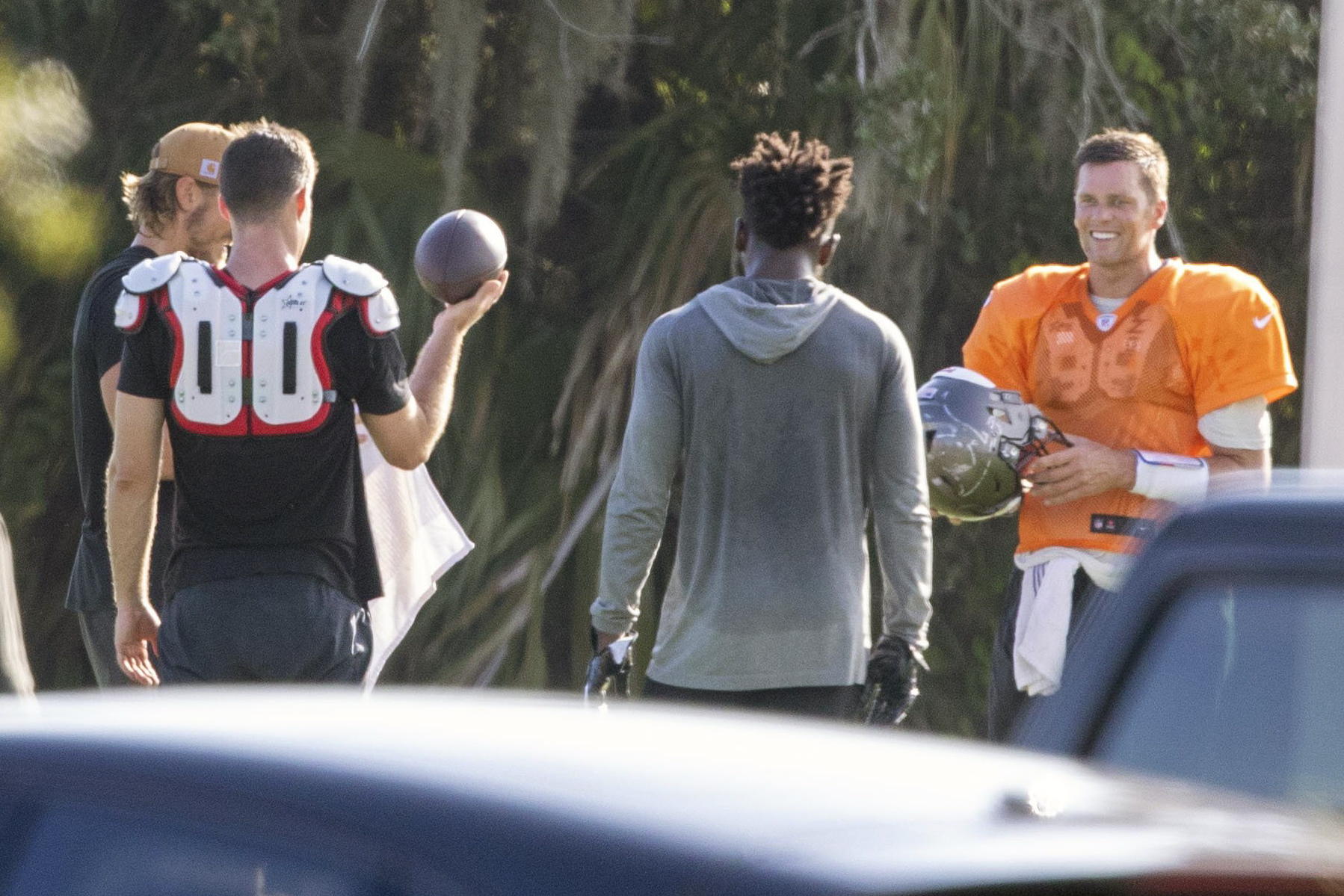 Tom Brady, in Tampa Bay orange, gathers new teammates for workout