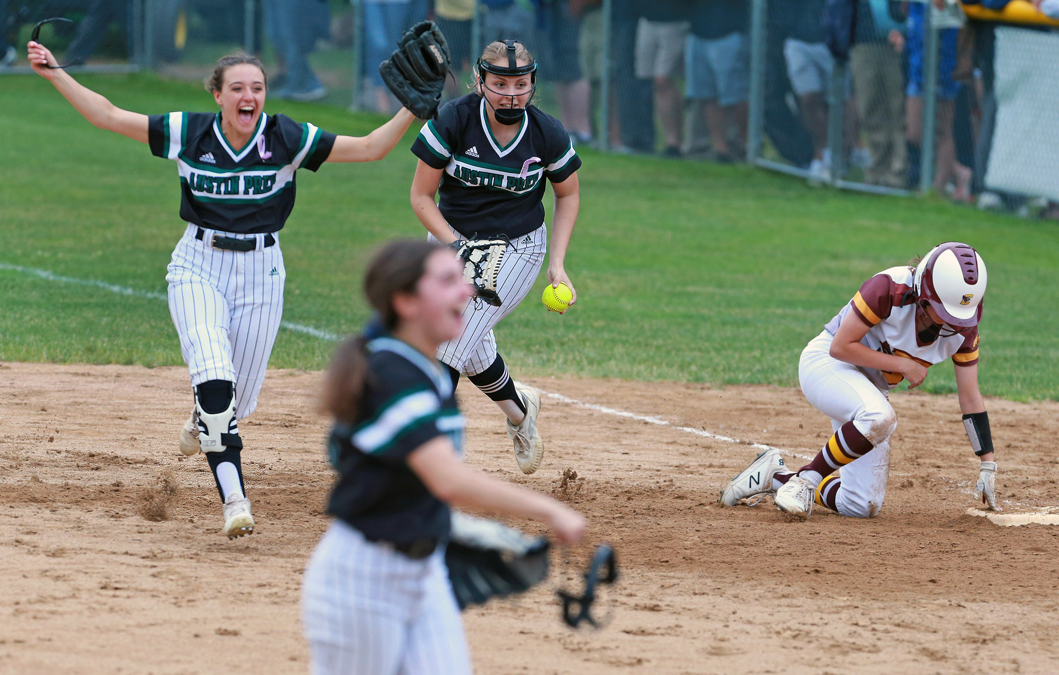 With Austin Prep leading, 10-7, right fielder Alexandra Santostefano (left) made a running catch of a line drive and threw to Brianna Meroli (with ball) for a game-ending double play to beat Case in the Division 3 softball semifinal in Taunton on June 19.