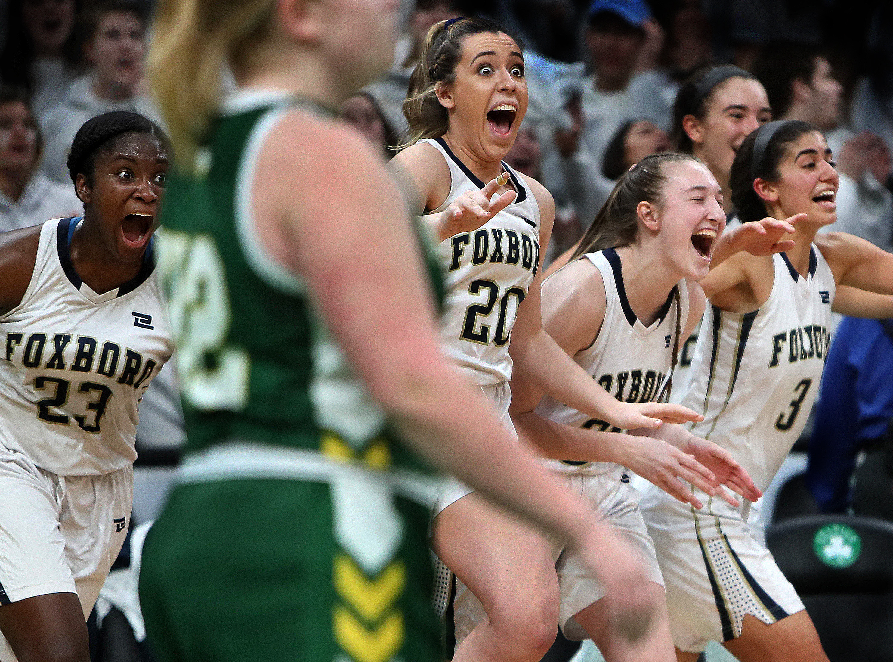 The Foxborough girls’ basketball players celebrated their win over North Reading in the Division 2 girls’ basketball semifinal at TD Garden on March 11.