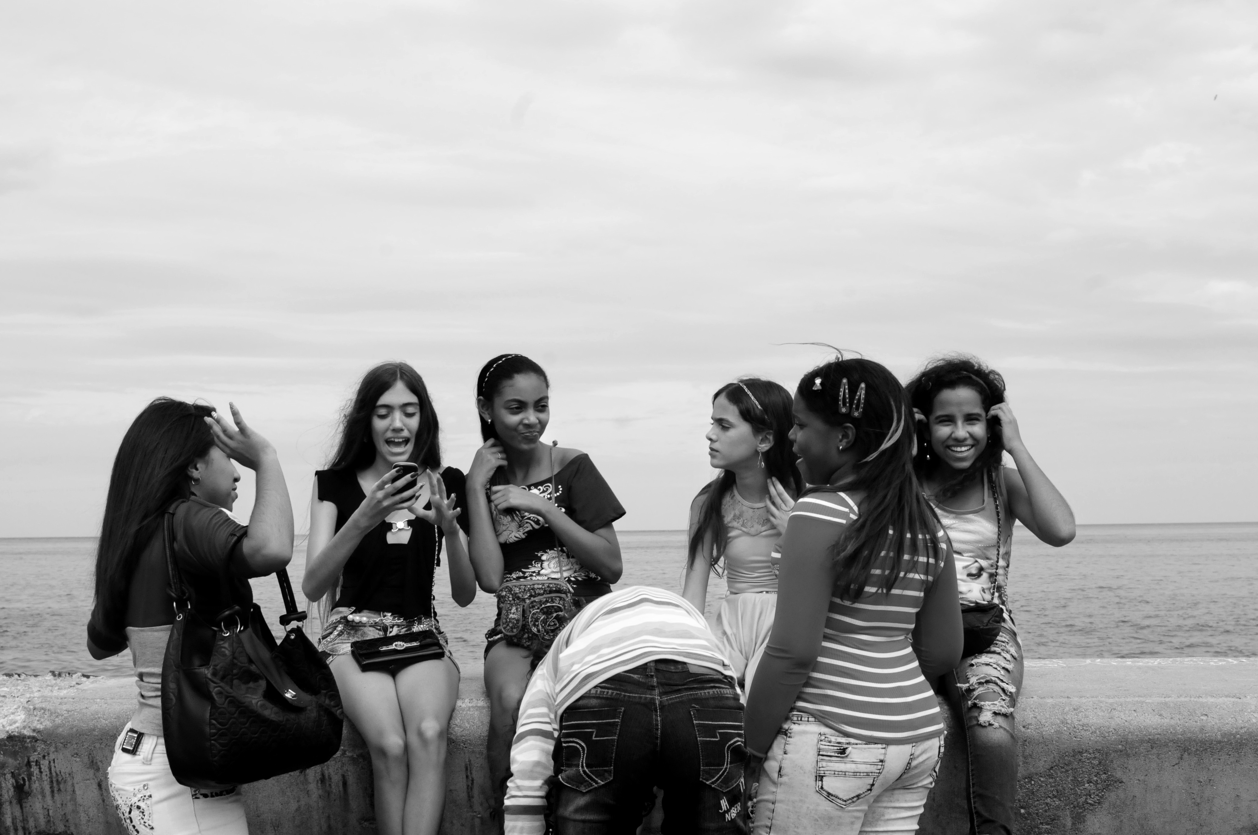 Young girls on El Malecón in Havana.