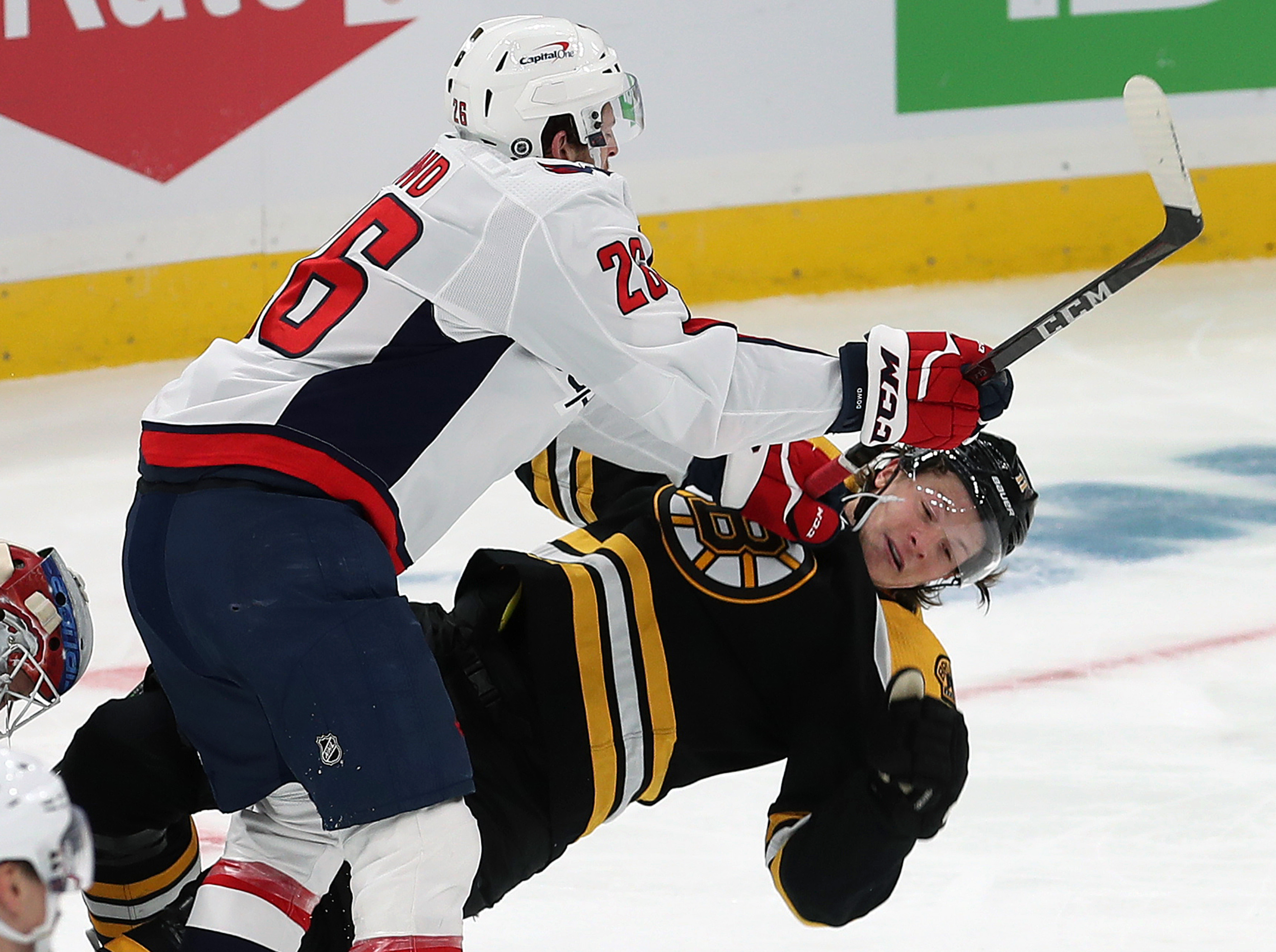 Trent Frederic gets knocked to the ice by the Capitals' Nic Dowd in the second period of Wednesday's game.