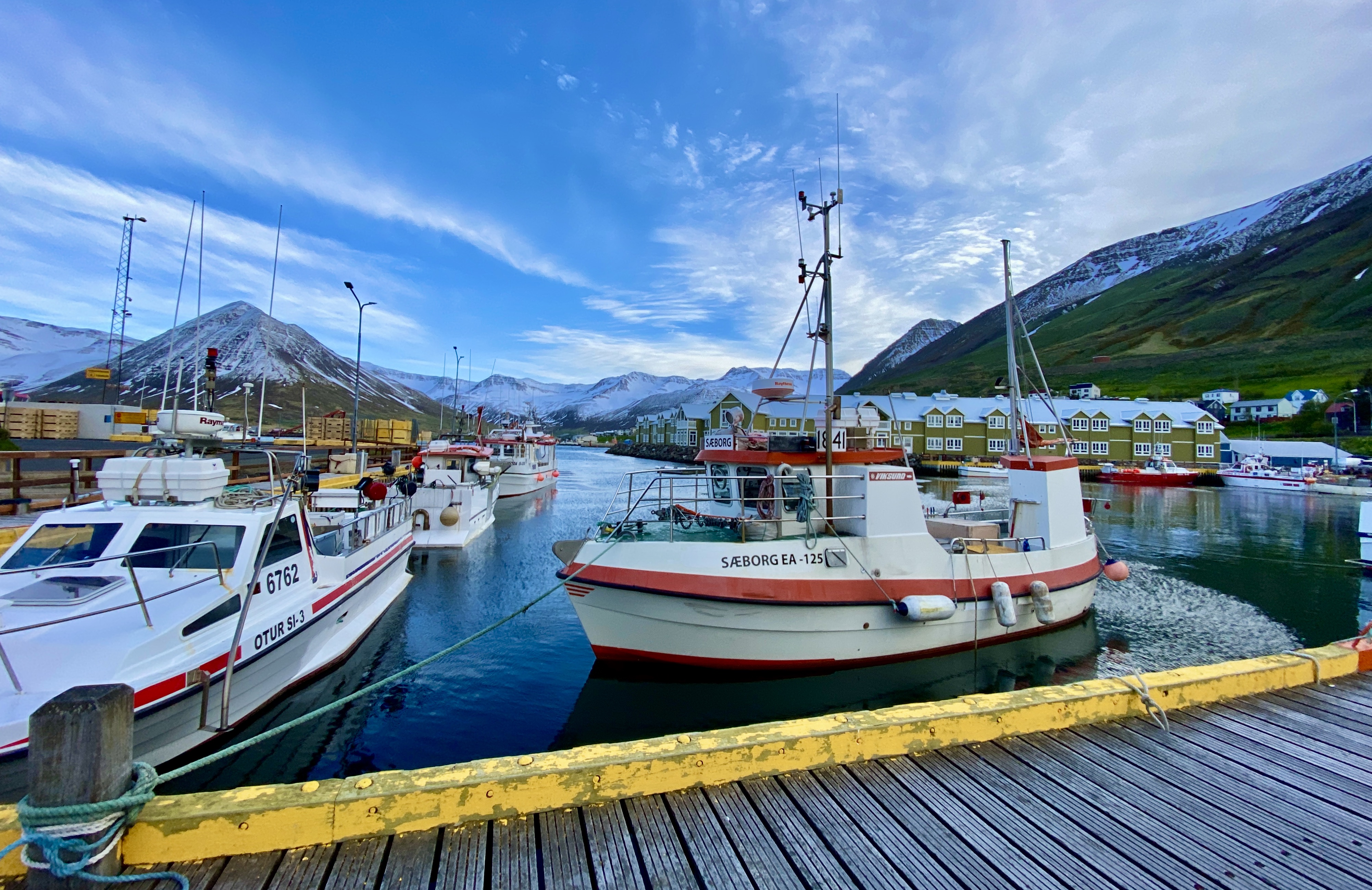 Boats in the harbor of the tiny Icelandic fishing town of Siglufjörður.
