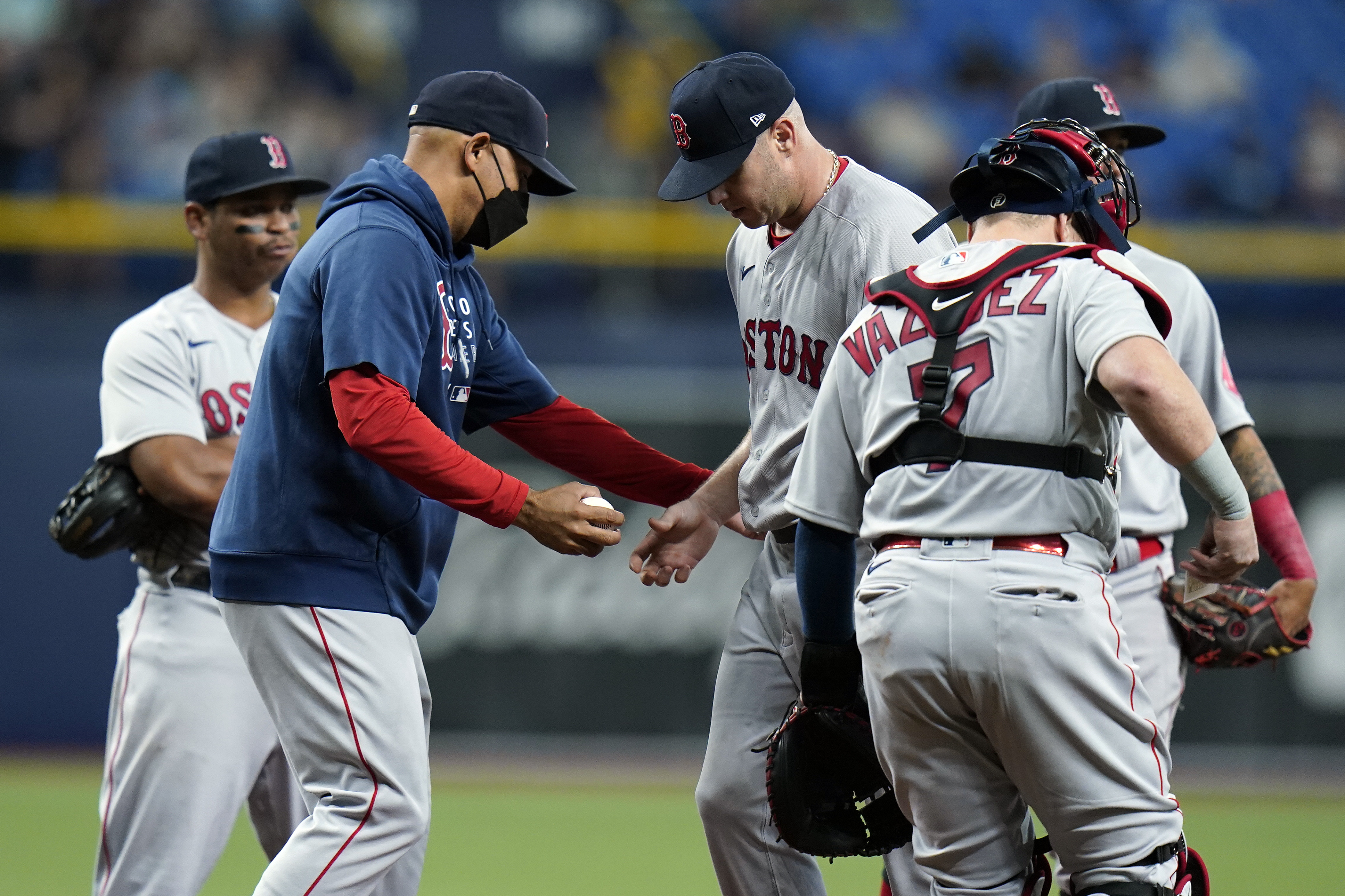 Alex Cora takes the ball from Brad Peacock in the third inning of Tuesday's game..